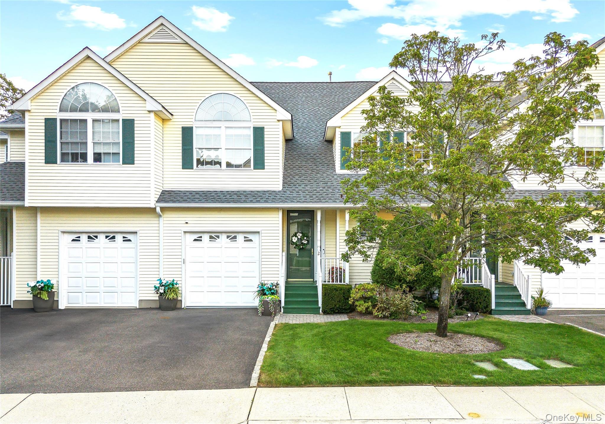 Experience sun-filled comfort and elegant living in this mint condition townhouse on a peaceful cul-de-sac just moments from vibrant shops, restaurants, and beaches. Enter a dramatic two-story foyer that flows into an open concept living space with hardwood floors, new hi hats LED lights, brand new first floor bathroom, crown molding, and a gas fireplaceâ€”perfect for relaxing or entertaining. The chef&rsquo;s eat-in kitchen features granite counters, stainless appliances, and a central island, with the dining room opening to a private deck and perennial gardens. Upstairs, the spacious primary suite boasts two walk-in closets, tray ceiling, and a spa-inspired bath. A generous second bedroom, chic guest bath, convenient laundry, and a finished basement ideal for a home office or gym complete the layout. Enjoy central air, attached garage, community amenities, and pet-friendly living in a meticulously maintained, move-in ready home that blends modern luxuries with daily convenience. Welcome home!