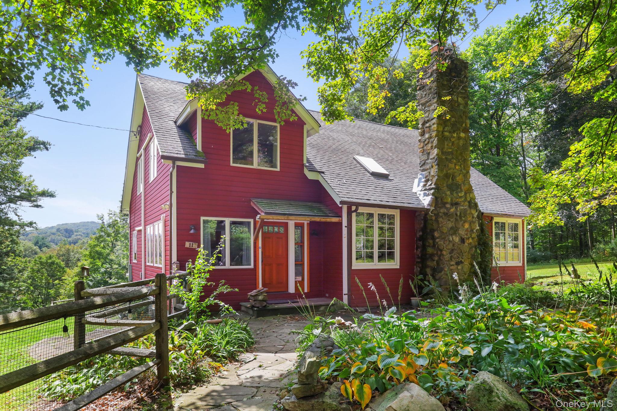 A magical retreat surrounded by 14 acres of protected, forever-green land, with mature pine forests on two sides and a year-round flowing trout stream with a deep swimming hole. This charming farmhouse-style home, lovingly cared for by the same owners for 30 years, offers 3 bedrooms + office and 2 full baths.The heart of the home features a stone fireplace, built-in bookcases, and vaulted ceilings. The family room showcases custom stained glass and a cozy, inviting atmosphere. The open kitchen overlooks the stream, mature plantings, and a thriving vegetable garden, surrounded by flowering trees and shrubs including dogwood, catalpa, weeping cherry, rose trees, blueberries, and raspberries. Garden sheds and a full walk-up attic provide extra storage.Updates include a new heat pump and AC, hot water heater, insulation, Andersen windows, and professionally maintained interior and exterior paint. A first-floor bedroom and full bath are ideal for guests, while the primary bedroom offers sweeping night-sky views. The updated full bath includes a sauna. You will be surprised and delighted to discover Quail Ridge just 50 miles from NYC and it feels like its own peaceful secluded retreat tucked away yet still close to everything. Situated on a quiet dead end with no drive by traffics.