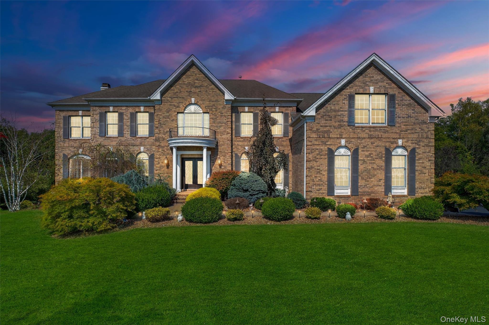 Prepare to be captivated by this one-of-a-kind 5 bedroom, 4.5 bath luxury estate in the prestigious Old Hopewell Estatesâ€”an extraordinary residence that seamlessly blends elegance, privacy, and resort-style living with town water/sewer and low taxes. Perfectly sited on a manicured 1-acre corner lot, this custom Colonial boasts over 6, 000 sq. ft. of refined living space plus a fully finished 1, 700+ sq. ft. walkout basement designed as a true mother/daughter or multi-generational suite with its own full kitchen, spacious living and dining areas, luxury bath, private laundry room, fireplace, and direct access to the backyardâ€”making it completely self-sufficient for extended family or guests. From its commanding brick facade, stone-accented driveway, and double-door entry to the soaring two-story foyer with dual staircases, hardwood floors, and intricate millwork, every detail radiates sophistication. The main level is designed for both grand entertaining and everyday comfort, featuring elegant formal living and dining rooms, a coffered-ceiling family room with fireplace, and a sun-filled home office. The gourmet kitchen is a showpiece with a massive quartz island, professional-grade appliances, custom cabinetry, and a garden window overlooking the lush grounds, flowing seamlessly to a dramatic breakfast area and expansive patios. Upstairs, the primary suite is a private retreat with sitting room, dual custom closets, fireplace, and a spa-inspired bath with limestone floors, soaking tub, and oversized walk-in shower, while four additional bedrooms include a princess suite and Jack & Jill accommodations. Step outside to your own resort-style paradiseâ€”a heated saltwater pool with natural stone accents, multiple stone-paver patios, an outdoor kitchen, European-style gazebo, tranquil fountain garden, and cozy firepit lounge, all surrounded by professional landscaping for ultimate seclusion. Additional highlights include a heated/air-conditioned 3-car garage, whole-house sound and security systems, and a commuter-friendly location just 5 miles to Metro-North and 75 miles to Manhattan. Combining timeless elegance with unmatched functionality, this estate is the crown jewel of Old Hopewell Estatesâ€”a forever home offering true multi-generational living, luxury, and lifestyle.