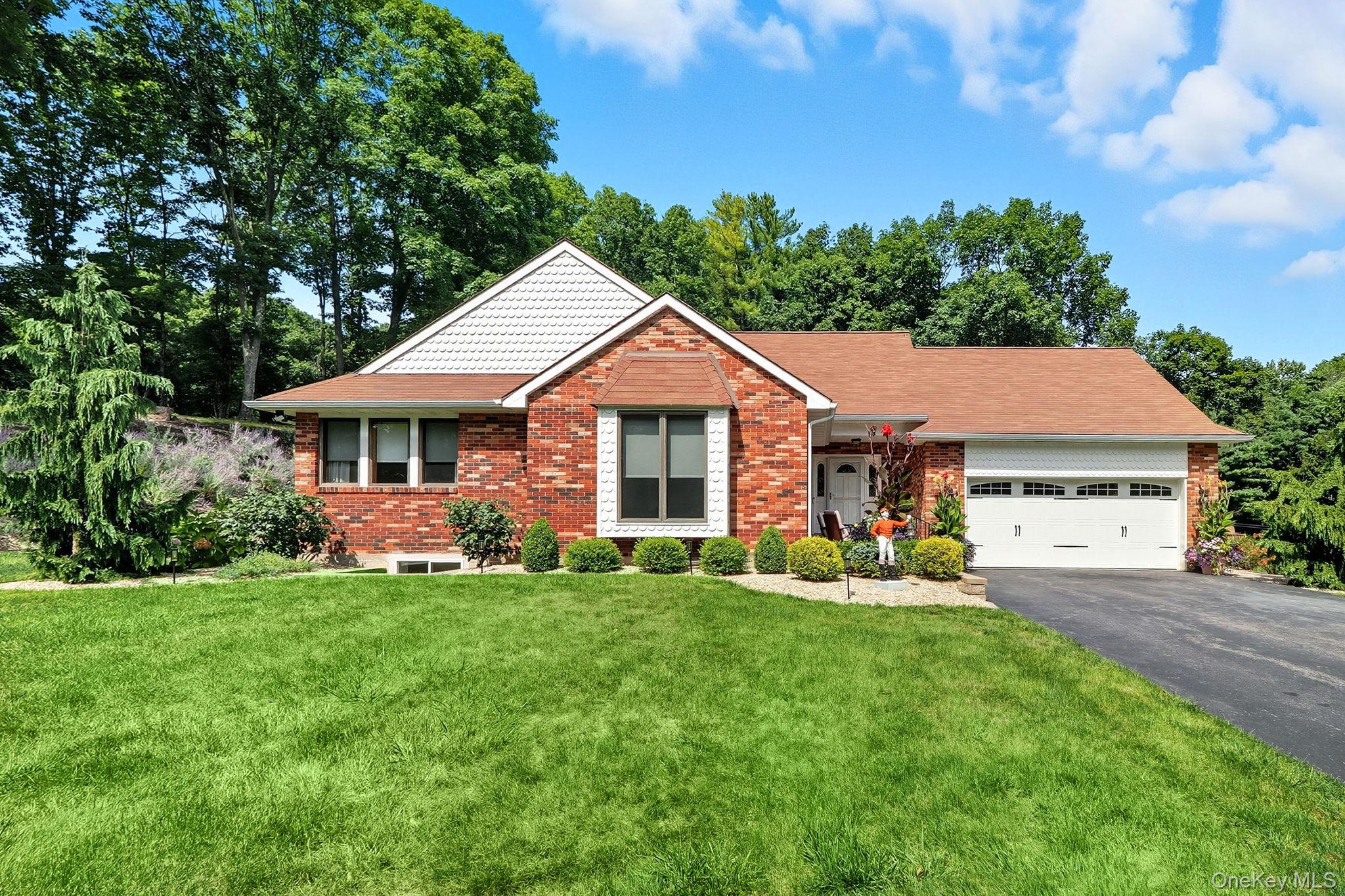 This beautiful ranch-style home offers complete serenity and privacy, set back from the road with an elegant entrance framed by brick walls and enhanced with well-placed landscape lighting. Designed by the award-winning Beechtree Landscaping of Poughkeepsie, the grounds are stunning and meticulously maintained.Inside, the home surprises with a wealth of features, including a modern kitchen, floor-to-ceiling casement windows, gleaming hardwood floors, and updated bathrooms. The full basement provides additional living space with egress to a backyard that has been carefully designed for future possibilities. Whether you envision a pool, tennis court, basketball court, or even a guest house, this property provides the flexibility to make it your own. Spacious and versatile, this home is ideal for families seeking comfort and opportunity, with the potential for income and expansion all under one roof. Perfectly located for those who value privacy while remaining close to shopping, parks, nature, and all that the Hudson Valley has to offer. This home is truly a must-see.