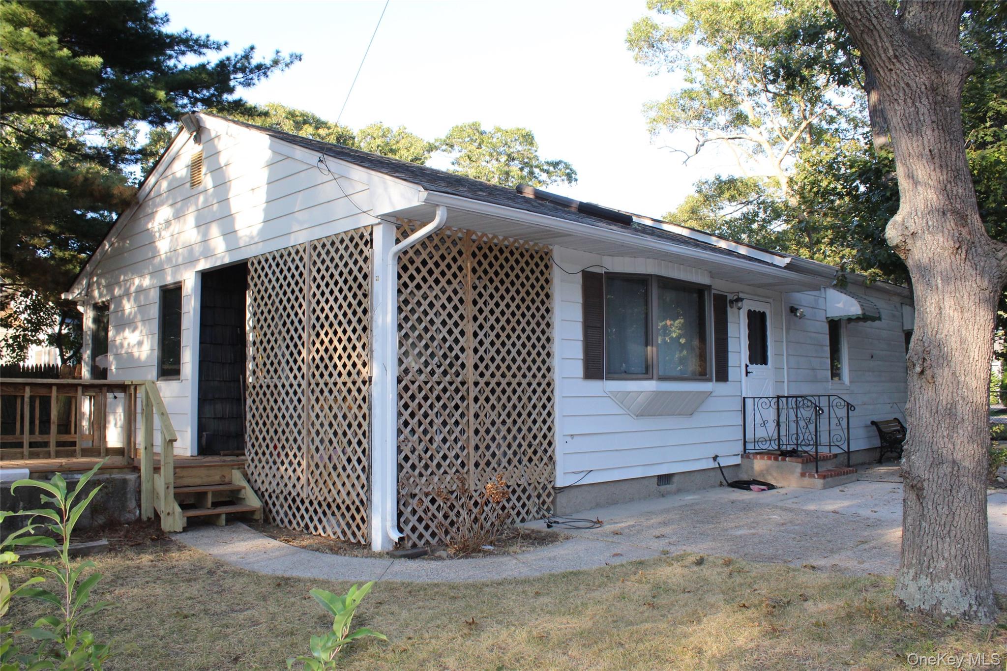 Welcome to this charming Ranch-style home situated on a corner lot in Selden. This residence features 2 bedrooms, 1 full bath, and a versatile bonus room that can easily serve as an office, guest space, or hobby room. The large eat-in kitchen, updated just 3 years ago with new flooring and a solar tube for natural light, is perfect for everyday living and entertaining.Additional highlights include a spacious laundry/pantry room, a recently updated deck, and mechanical updates with the roof and boiler replaced approximately 7 years ago. The home is serviced by a cesspool with overflow.Enjoy the benefits of one-level living with plenty of functional space inside and out. Whether relaxing on the deck, working in the bonus room, or gathering in the kitchen, this property offers flexibility and convenience. Additional photos forthcoming.