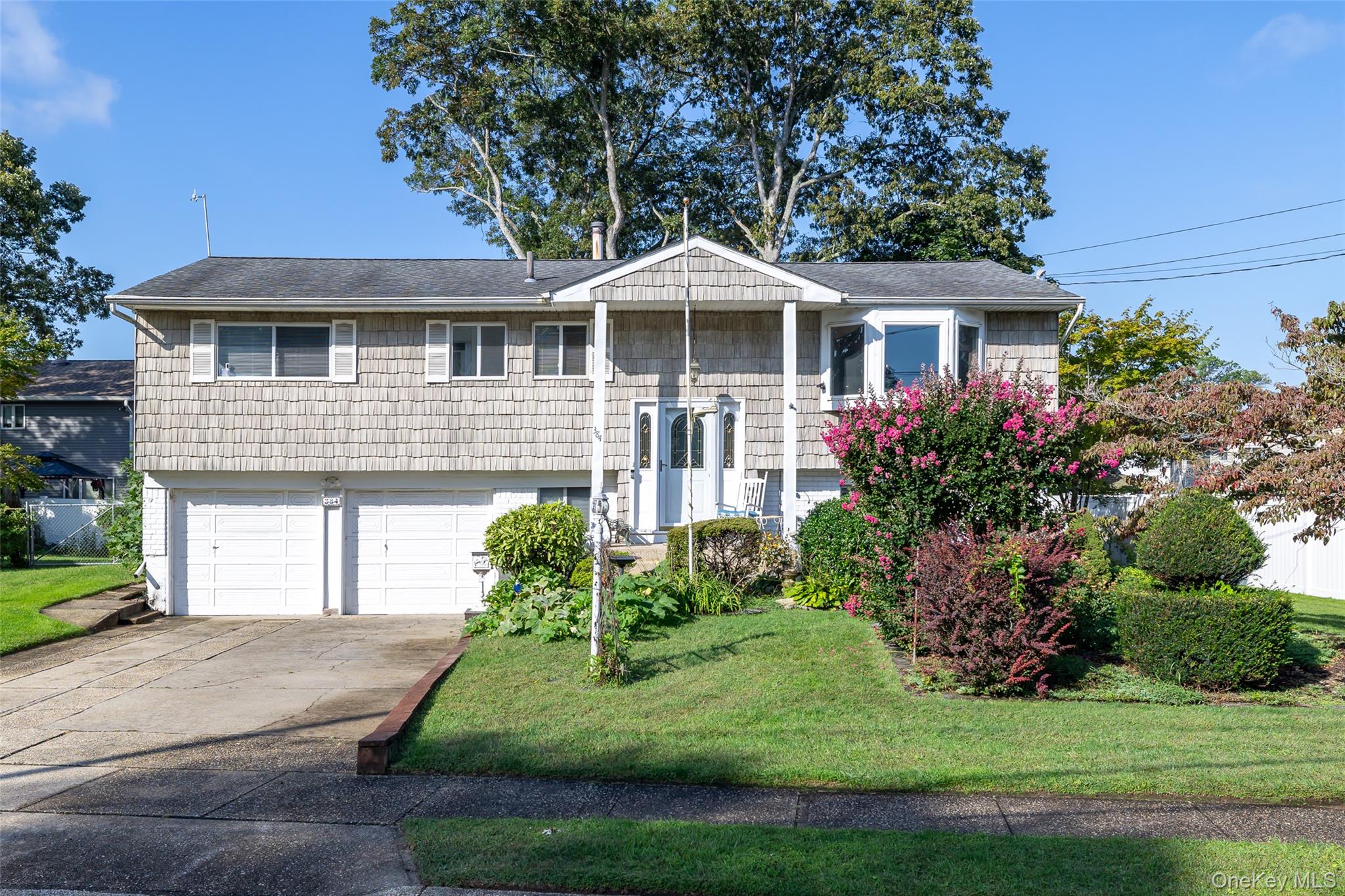 Welcome home to this spacious high ranch in a Deer Park Cul-de-sac. This home features 5 bedrooms with 2.5 baths. The main floor boasts 4 bedrooms with an ensuite in the primary bedroom. There is a galley kitchen and a separate formal dining area to enjoy your meals and relax in the sunlit living room. The lower-level features 1 bedroom, a living area, and a half bath. The roof is approximately 11 years old. There are 2 heating zones with gas heat, central air and much more. This property is convenient to schools, restaurants and shopping. Make this property your home!