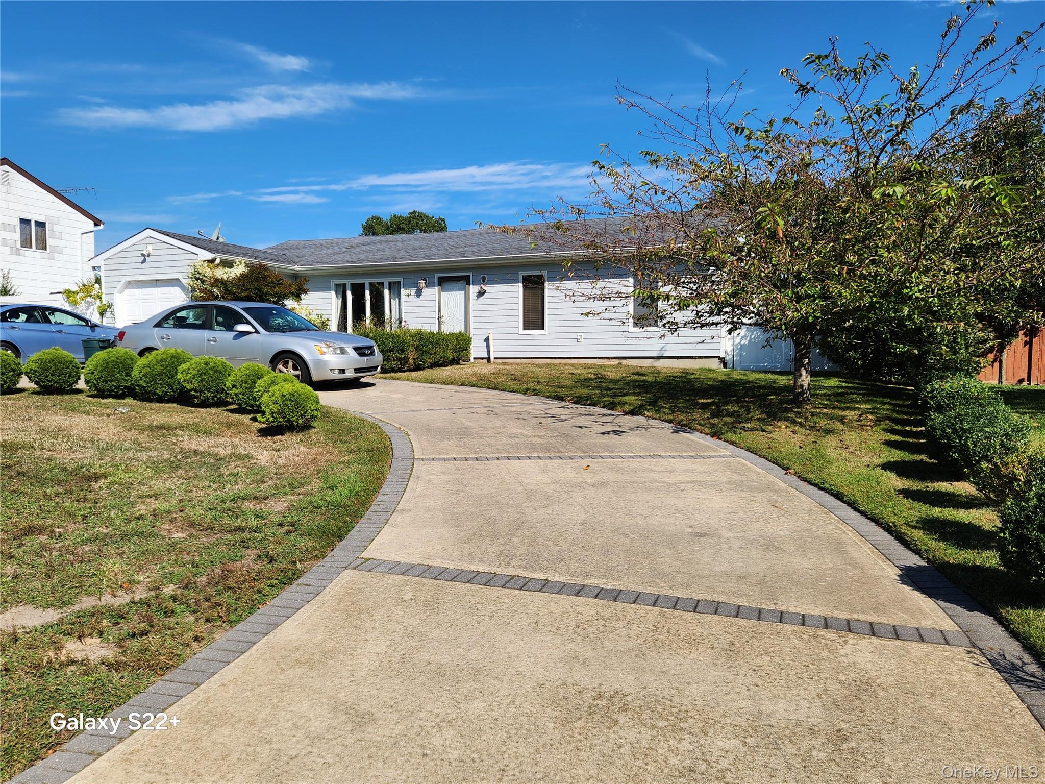 Spacious Ranch is located conveniently near the LI Expressway and major shopping centers. The updated Kitchen has Stainless Steel appliances, a Granite Center Island, a Glass Backsplash, recessed lighting, and a Skylight. The Living Room has recessed lighting and a wall of windows. The Formal Dining Room has Laminate Flooring, Recessed Lighting, and a Ceiling Fan. One Bedroom has its own Full bath, and Windows, Roof, and Siding have been replaced.. The property is fully fenced. The home has a floor plan that offers a variety of uses for the extended household.