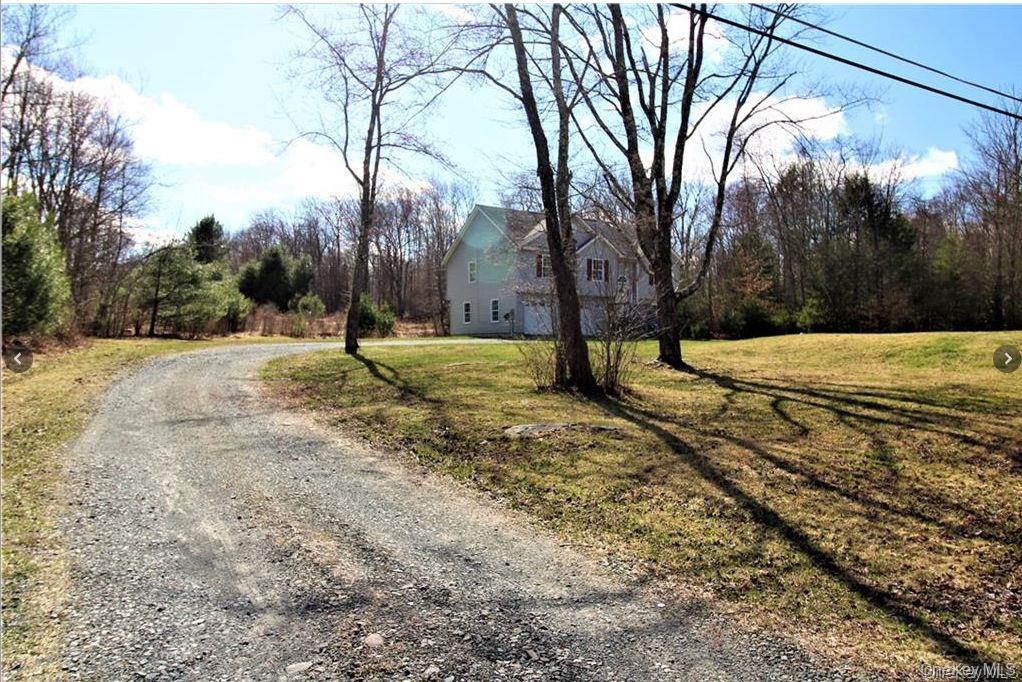 Privately located large house in natural setting with three bedrooms and two full baths on upper floor plus cathedral ceiling with additional rooms. Large living room with gas fireplace, open kitchen, comfortable walk to upper deck for entertainment and barbeque overlooking peaceful backyard. Lower level has two additional rooms with full bath and walk-in closet. Large room has French door leading to backyard. Oversized two car garage finished with sheetrock. Hardwood floors throughout and tiled hallway. Central heating and AC,  Beautiful house for large family only minutes drive to shopping, entertainment and Shawangunk ridge hiking, biking and horseback riding. Additional Information: Amenities:Storage, ParkingFeatures:2 Car Attached, Home needs Updates this is a short sale and is subject to Bank approval