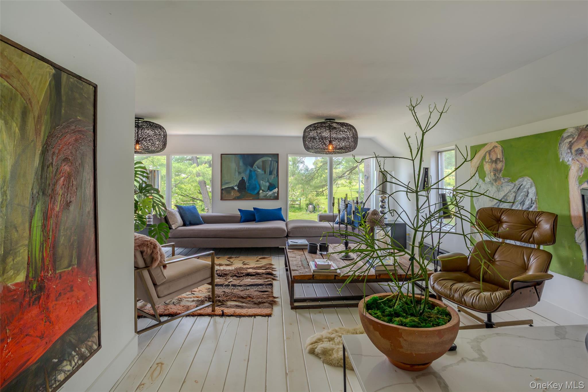 Historic Elegance, Reimagined for Modern LivingSet amid the rolling landscapes of the Catskills, this 1845 farmhouse has been masterfully reimagined, marrying historic charm with contemporary refinement. The result is a residence of rare characterâ€”timeless yet entirely turn-key.Resting on three landscaped acres framed by old-growth trees, perennial gardens, and raspberry bushes, the property unfolds with a graceful circular drive, a classic front porch, and a generous back deck overlooking the poolâ€”an ideal setting for both quiet mornings and elegant evenings under the stars.Within its 2, 800 square feet, the home offers five bedrooms, including a serene main-level primary suite. Upstairs, a marble-tiled bath with soaking tub anchors the private quarters, alongside three additional bedrooms and a light-filled media lounge.The interiors balance historic detail with modern sensibility. The formal dining room retains original built-in cabinetry, while the main living room doubles as a screening lounge with projector and retractable screen and wood burning stove. At the heart of the home, the chefâ€™s kitchen is fitted with a Z-Line gas range, central island, custom cabinetry, stainless steel appliances, and wine storageâ€”crafted as much for entertaining as for daily living.Throughout, wide-plank hardwood floors, new wood-burning stoves, and cast-iron radiators serviced by a five-zone Navien system speak to both craftsmanship and comfort. A comprehensive renovationâ€”completed just four years agoâ€”brought new insulation, plumbing, electrical, flooring, and baths, alongside a whole-house triple-bypass water filtration system.Outdoors, lifestyle amenities abound: an in-ground pool framed by mature trees, , a fire pit, fenced dog run, and multiple storage outbuildings and a a vast 40â€™ x 75â€™ metal barn offering over 2, 000 square feet of parking or studio space!!Perfectly positioned just minutes to the charming main streets of Callicoon, Jeffersonville, Livingston Manor, and Bethel Woodsâ€”and just 2.5 hours from New York Cityâ€”this property offers an uncommon opportunity to experience Catskills living at its best!!
