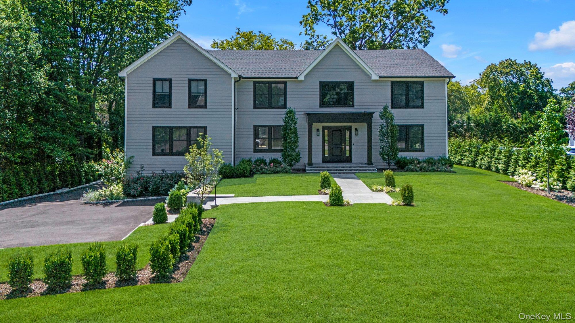 Bright, open, and expertly built with the highest quality features and finishes by a distinguished Hamptons developer, this nearly 7000sf home, fully completed in 2025, over delivers in every way. The floor plan is intuitive. The living space is unified by the consistent use of 8â€ white oak flooring, glass panel railings along the 3-level staircase, high ceilings and oversized windows.The complement of rooms on the first floor offers optionality: a large room off the front door is equally suited to a home office, den or bar and sits across the double-height foyer from the dining room. The impeccably outfitted chefâ€™s kitchen backs a generous walk-in prep kitchen/pantry and the breakfast area opens to a handsome mahogany outdoor deck. The adjoining living room/great room features a full-height (gas) fireplace wall, and another spacious room makes a perfect playroom or game room. The home features 6 oversized en-suite bedrooms and 6.5 baths, with 4 (including the primary) on the second floor, one on the first floor and the last in the lower level which also includes a gym, wine closet, large recreation space, mudroom, outdoor access and access to the two-car garage with EV-charger. and true egress via covered bluestone patio. For ultimate convenience, there is a second floor laundry room with two sets of washers and dryers. Prime Flower Hill location. Exquisitely landscaped .4-acre property. This exceptional offering could not be duplicated for its asking price if built today.