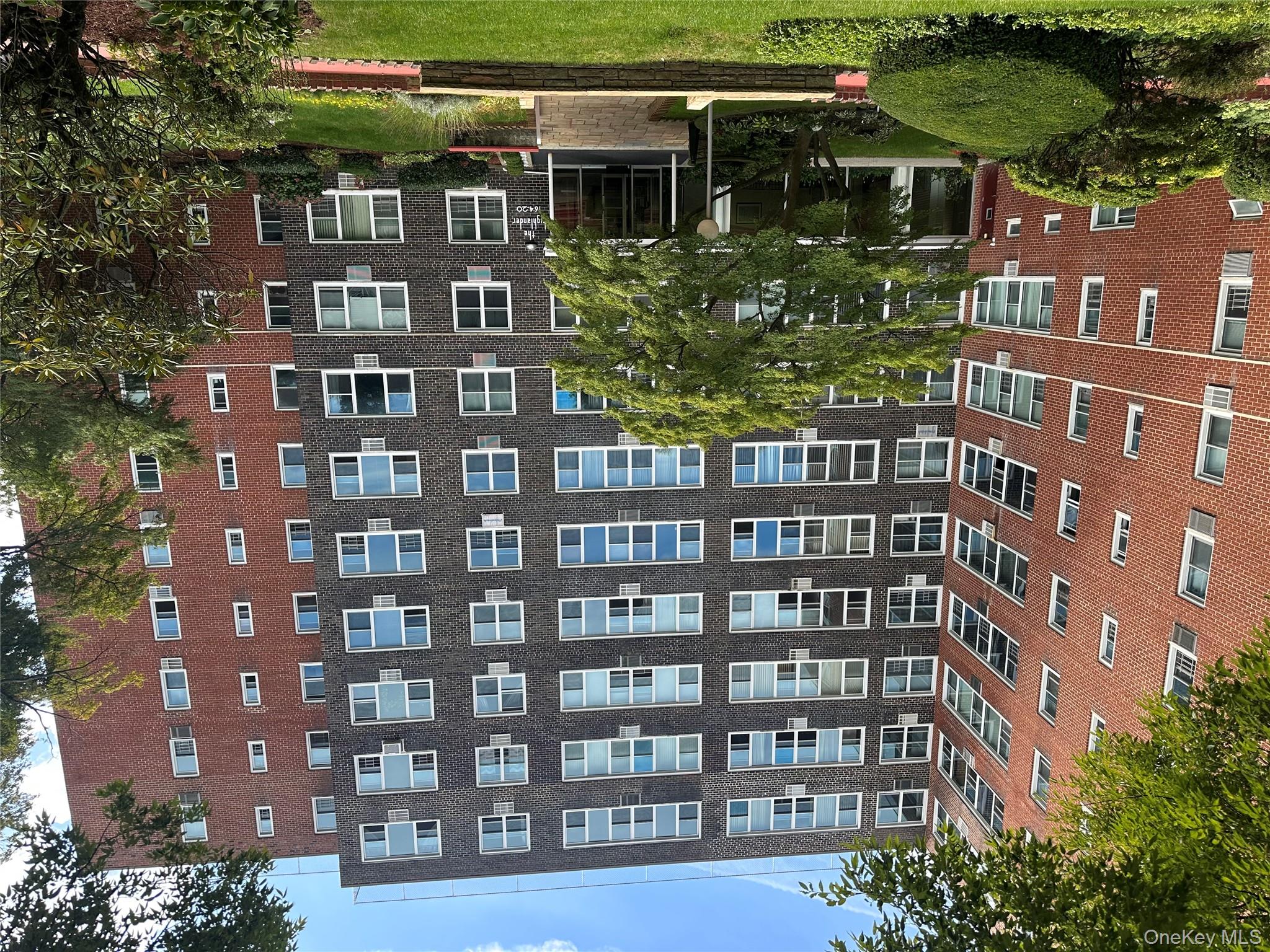 Discover a rare opportunity to own a spacious 2-bedroom, 2-bath co-op in the desirable Highlander building, ideally located in Jamaica Hills directly across from scenic Tilly Park. This sunny and freshly painted 1, 200 sq. ft. unit offers a bright and airy layout featuring a large living room, L-shaped dining area, and new ceramic tile flooring. Ample closet space.The updated kitchen includes stainless steel appliances. Both bathrooms have been renovated. One of the bedrooms is a primary suite with a full bath.  Sale includes lighting fixtures, and window treatments. Building amenities include a doorman, on-site superintendent, laundry facilities, and outdoor parking (waitlist). Conveniently located just one block from Hillside Avenue, residents enjoy easy access to shopping, public transportation, and schools.