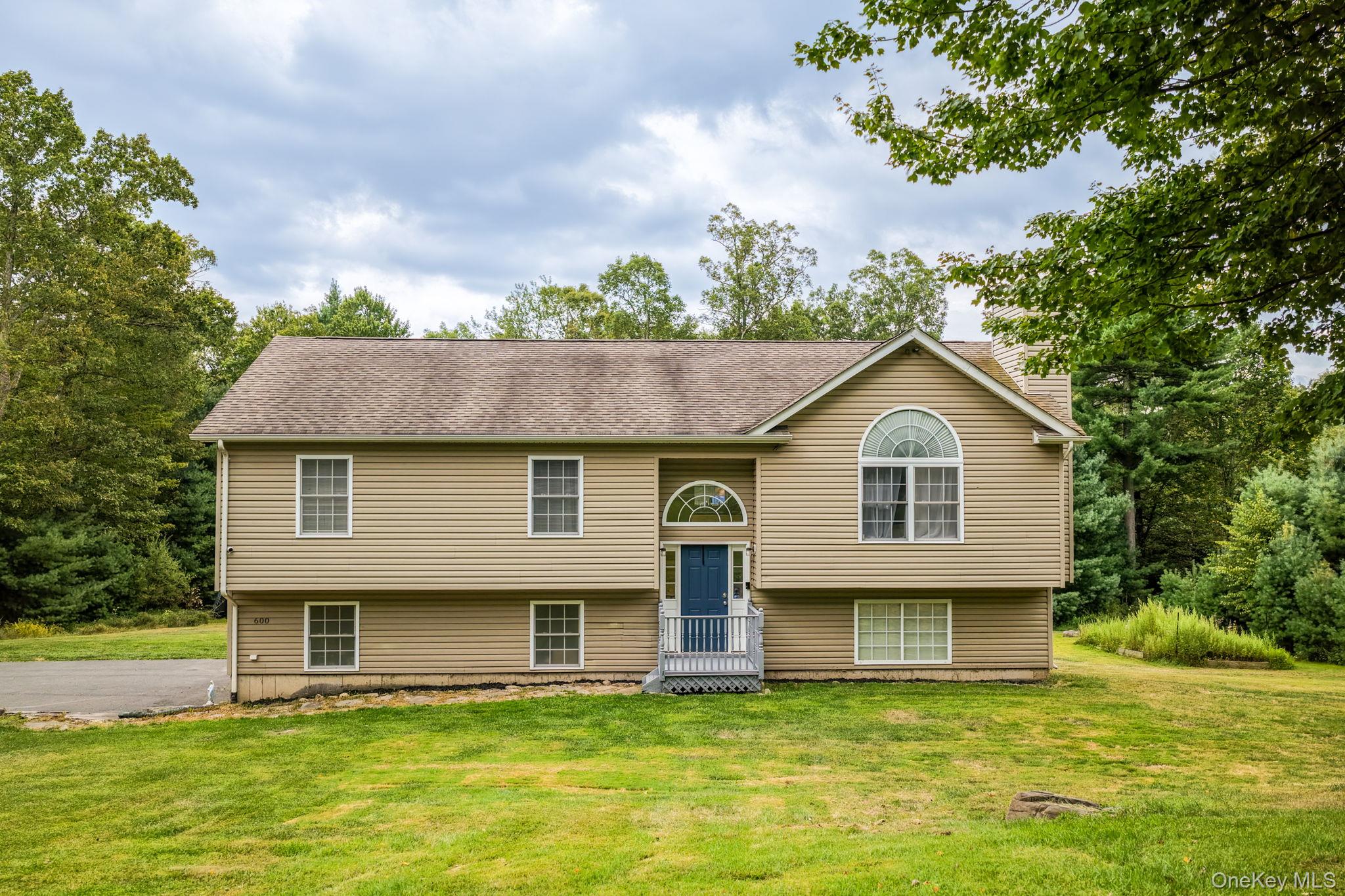 Tucked away in the scenic Catskills yet just 15 minutes to modern conveniences, this beautiful raised ranch offers the perfect balance of peaceful privacy and sustainable living. Situated on 5 picturesque acres within the Fallsburg School District, this property features an expansive open front and back yard, lush mature woods, a chicken coop, fire pit, garden area, and plenty of space to explore or relax in nature. Follow the long paved driveway to a 2-car attached garage, inviting covered front porch, and a large composite back deckâ€”ideal for gatherings and year-round enjoyment. Inside, you&rsquo;ll find over 2, 100 sq ft of finished living space thoughtfully laid out across two levels. The main level features soaring vaulted ceilings, oversized windows that flood the space with natural light, and hardwood flooring throughout the open-concept living, dining, and kitchen areas. The living room centers around a stunning stone-faced wood-burning fireplace with insert, perfect for cozy evenings. The updated kitchen is both functional and stylish, boasting stainless steel appliances, an oversized refrigerator, new tile backsplash, ceramic tile floors, a 5-burner gas/electric range, recessed lighting, and a spacious island for entertaining. The main level continues with three well-appointed bedrooms and a full bathroom featuring double sinks, a jetted soaking tub, glass-enclosed stand-up shower, skylight, and ceramic tile. Downstairs, the walkout lower level offers incredible versatility with a recreational room, a fourth bedroom with access to a private floating deck, a second full bathroom, and a separate laundry room.Energy-Saving Features: One of the home&rsquo;s standout features is its fully-owned solar panel system, which powers the heating, cooling, and hot water. Additional energy-efficient upgrades include: Mitsubishi Hyper Heating System & central air on the main level, Split unit heat pumps on the lower level, Modern, low-maintenance mechanicalsWhile you&rsquo;ll love the secluded, natural setting, you&rsquo;re still within: 15 minutes to shopping, restaurants, and highway access to NYC (under 2 hours away), A short drive to hiking & biking trails, lakes & rivers, wineries, and Catskills/Hudson Valley attractions like Bethel Woods, Samâ€™s Point, and Minnewaska State Park. Whether you&rsquo;re looking for a weekend escape, full-time residence, or modern homestead, 600 County Rd 56 offers lifestyle, efficiency, and spaceâ€”all surrounded by nature.