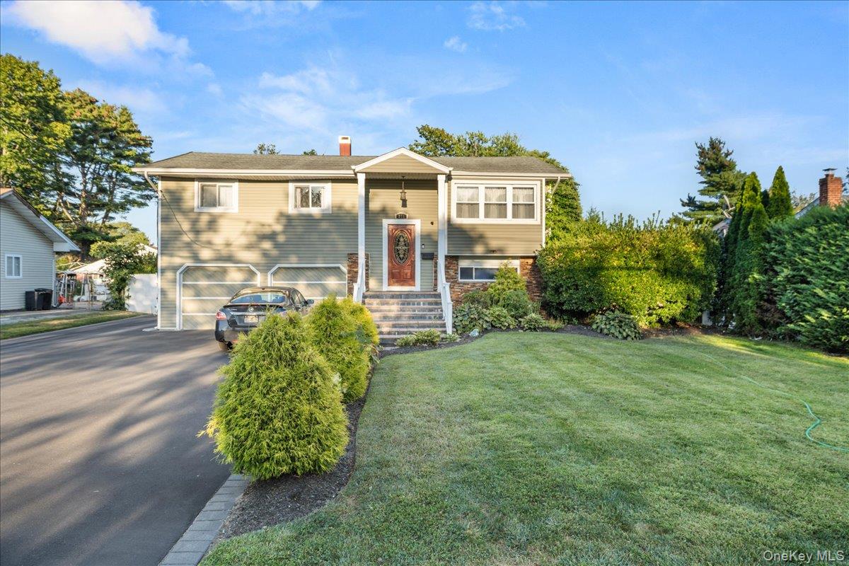 Step into comfort and convenience at this spacious two-level home on a quarter-acre in Brentwood. Sunlit living and dining rooms flow to a classic kitchen for easy everyday living and entertaining. The main level features two comfortable bedrooms and a full bath. Upstairs adds a private bedroom suite with walk-in closet, a versatile loft lounge, a full bath, and a handy kitchenette that is perfect for morning coffee or extended living with proper permits. The finished lower level provides a large recreation room, storage, and another full bath, offering space for play, a gym, or hobbies. Enjoy outdoor time on the deck and in the deep backyard. An attached one-car garage and long driveway provide ample parking. Convenient to parks, shopping, and major roadways. Located in the Brentwood Union Free School District. Schedule your showing today.