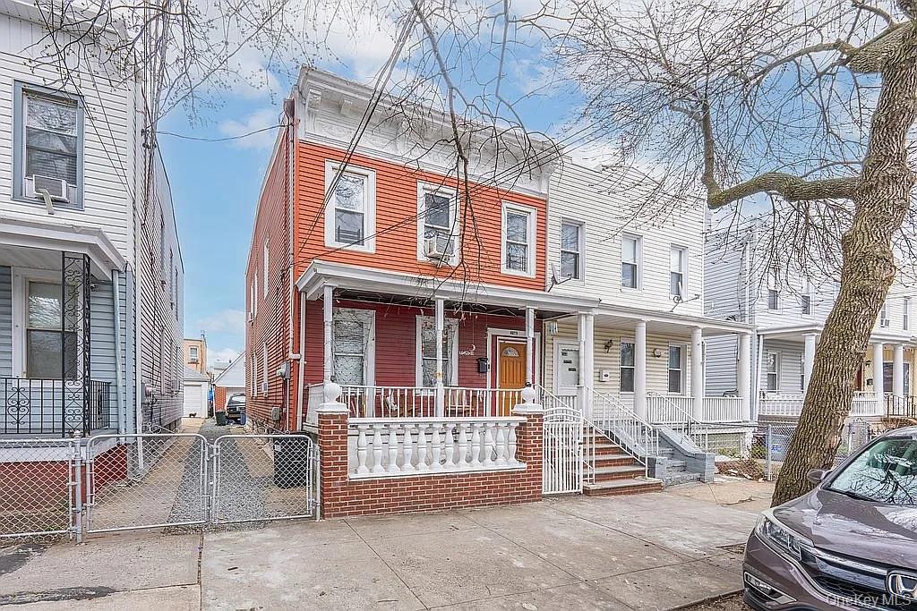 Two family home in a quiet street walking distance to public transportation, schools, house of worship, supermarket .