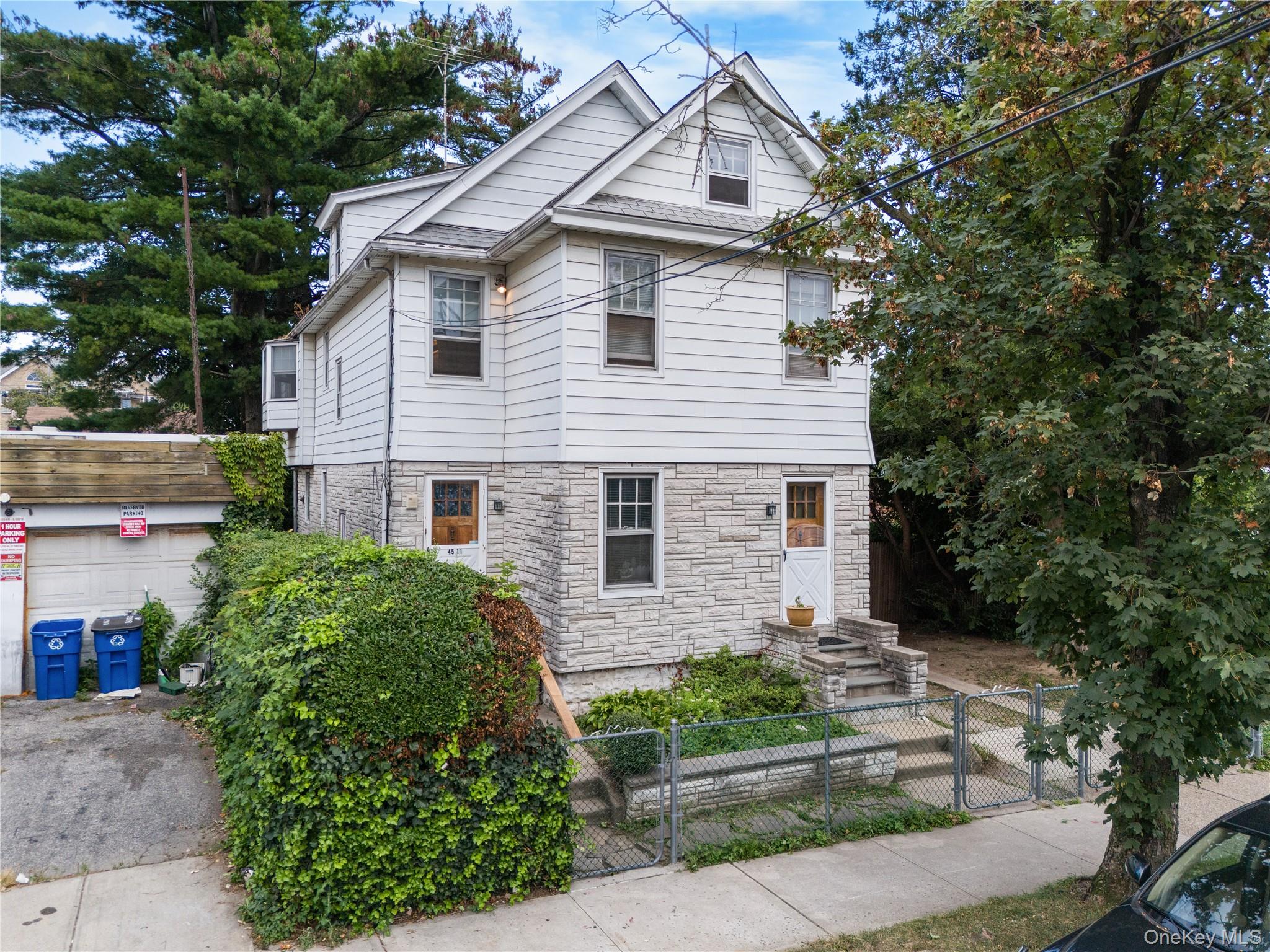 Welcome to this detached one-family home in the heart of Flushing! Situated on a generous 5, 000 sq. ft. lot, this property offers a rare two-family style setup while maintaining its one-family designationâ€”an ideal opportunity for homeowners or investors seeking space and flexibility.The first floor features a bright living room, formal dining room, functional kitchen, 2 bedrooms, and a full bath. Upstairs, youâ€™ll find an additional living area with its own kitchen, 3 comfortable bedrooms, and a full bathroomâ€”perfect for extended family use. The partially finished basement, complete with separate entrance and bath, offers even more options for recreation, guests, or a home office. A spacious walk-up attic provides additional versatility as a gym, office, or storage space.Highlights include two gas meters, two kitchens, private driveway, two-car garage, and a fenced backyard. Conveniently located just blocks from Kissena Park, near Q26, Q65, and Q27 buses, and only a 10-minute drive to Downtown Flushing, this home offers both comfort and convenience. Delivered vacant, itâ€™s a wonderful chance to create your dream home or maximize investment potential.