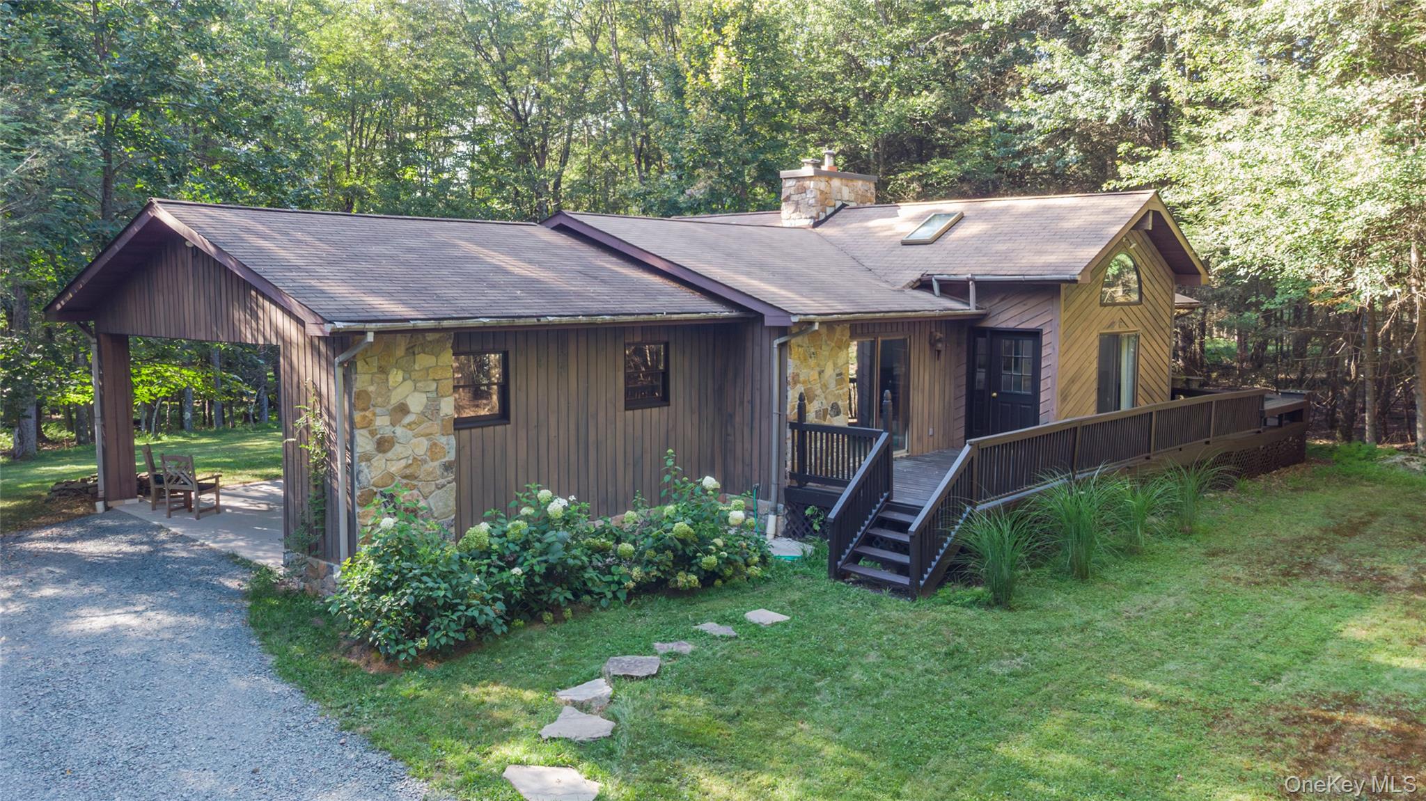 Peaceful retreat with recent upgrades and easy access to Black LakeSet far back from the road, 5 acres feels like 50 with peace and quiet and a beautiful setting surrounded by woods and dappled sunlight. Spend your days swimming and kayaking and then head home for a soak in the hot tub! The updated kitchen has a brand new tile backsplash, and new countertops and cabinetry. It leads out to a spacious dining room and the deck overlooking the back yard. Extra high ceilings in this space create a light and airy feeling while the impressive stone chimney adds character and warmth with an upgraded wood stove insert.There is plenty of room to spread out with two bedrooms plus a bonus flexible space that is perfect for a den, guest room or home office. The king-sized primary suite has its own full bath and double glass doors leading out to the deck. Both of the homeâ€™s bathrooms feature skylights and have new tile, vanities and toilets!Outside multiple decks, a hot tub and a stunning fire pit set the stage for leisurely days and cozy nights. The covered car port doubles as a perfect spot for enjoying nature even on a rainy day!Black Lake Estates is a lovely private community with peaceful tree lined roads. The lake is a serene, electric-motors-only lake that connects to a series of channels and smaller lakes. This home comes with a small row boat perfect for an afternoon on the water. The beach and boat launch/storage are less than a mile away. This special location has you immersed in nature but still super close to many great destinations in the area. Bethel Woods is 10 minutes away featuring incredible summer line-ups and fun events. Within 20-30 minutes â€“ on gorgeous country roads â€“ you will find all of the amazing offerings for dining, shopping, farmerâ€™s markets and entertainment in Narrowsburg, Callicoon Barryville, Livingston Manor and Jeffersonville. It&rsquo;s so great to be able to support so many fantastic local businesses so close to home! 20 mins to the Delaware River and just under 100 miles to the GWB in NYC.