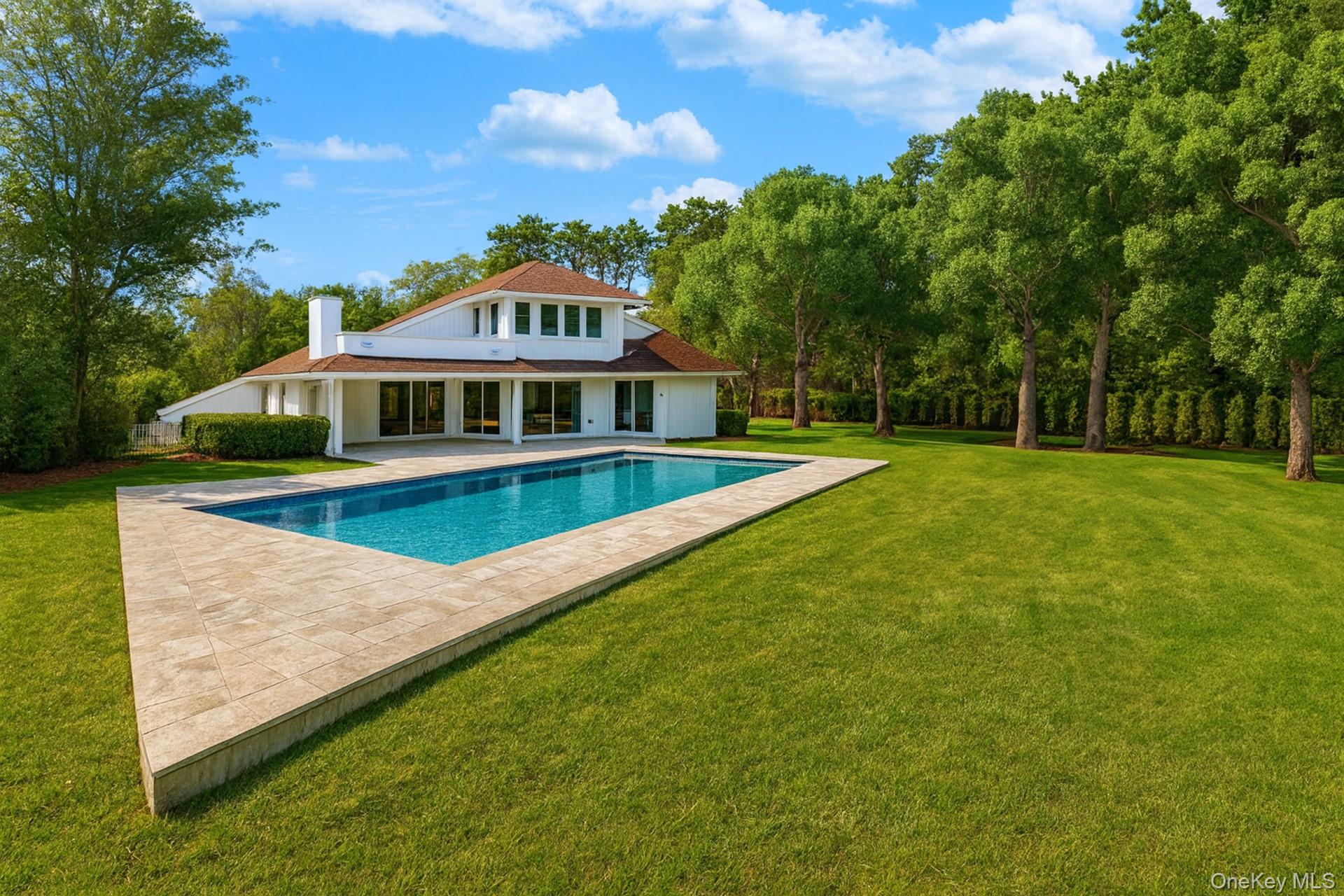 Experience the pinnacle of Hamptons summer living in this beautifully appointed 4-bedroom retreat, thoughtfully designed for both relaxation and entertaining. The sun-filled, open-concept layout seamlessly connects the gourmet kitchen, inviting living spaces, and expansive outdoor patio, creating an effortless flow for gatherings. Outside, a serene heated pool invites leisurely swims under the summer sun or starlit evenings. Every detail of this charming getaway blends comfort, style, and coastal elegance, making it the perfect setting for unforgettable moments. Now available for off season and summer 2026.