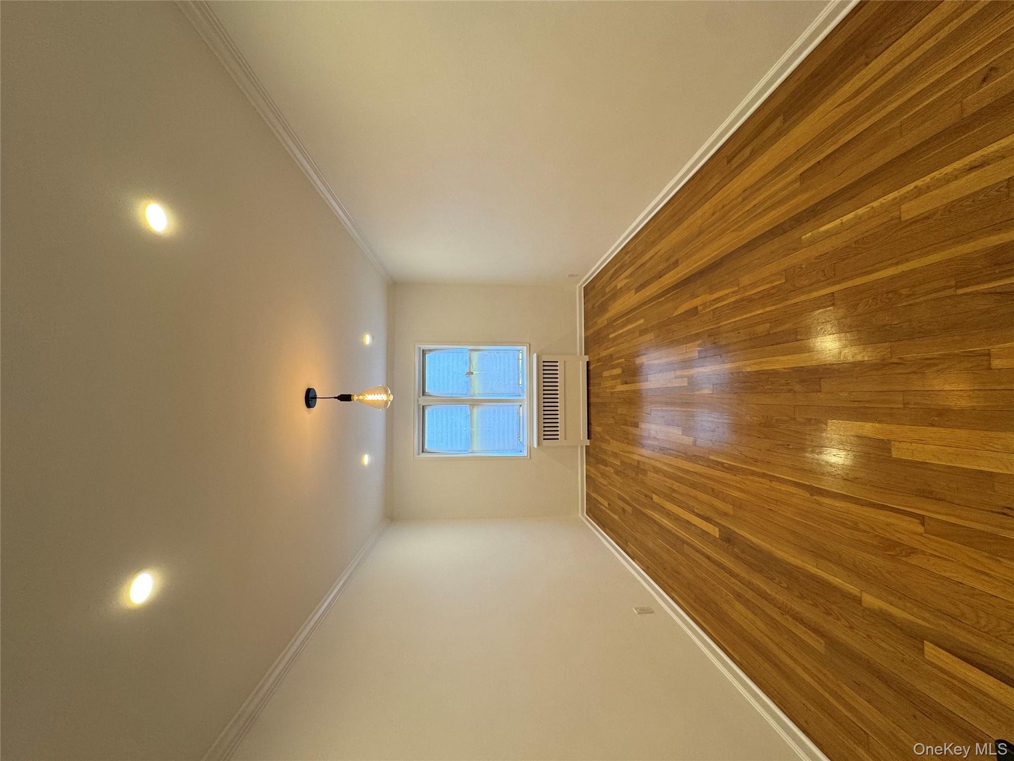 Gut-renovated 2-bedroom, 1-bath co-op featuring 1, 200 sq ft of thoughtfully upgraded living space. Fully updated electrical and plumbing systems, including new electric panel, GFCI protection, USB-C outlets, new shut-off valves, and smart home integration with 26 Wi-Fi-enabled recessed LED lights.Refinished hardwood floors, skim-coated walls with fresh paint, custom crown molding, base trim, and integrated radiator covers throughout. Kitchen features solid white quartz countertops with waterfall edges, large-format porcelain tile, custom white shaker cabinets with soft-close drawers, and premium stainless steel appliances including a 4-door French refrigerator, gas convection range, dishwasher, microwave, and 30â€ undermount sink with commercial-style matte black faucet.Bathroom includes floor-to-ceiling porcelain tile, floating vanity with integrated storage, anti-fog LED mirror, matte black fixtures, rain shower with hand spray, and dual-flush one-piece toilet.Additional upgrades include matte black hardware with Microban antimicrobial finish throughout, decorative pendant lighting, Nest smart home integration (Nest Mini, Nest Audio, Nest Hubs), and modern electrical and lighting updates throughout the home. Located near the Freeport Nautical Mile, shopping, restaurants, parks, and public transportation.Move-in ready.