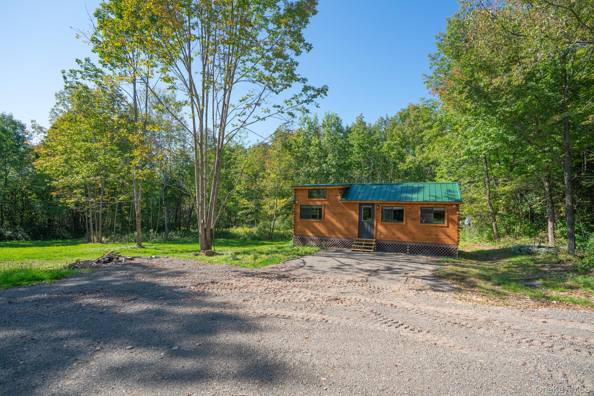 **Welcome to your dream escapeâ€”**a beautifully crafted, certified Amish-built RV cabin set on a stunning 10.24-acre lot in the desirable town of Franklin. Just one year old and still carrying the warm, rich scent of freshly sawn wood, this cabin blends rustic charm with modern comfort. Inside, youâ€™ll find two cozy bedrooms, a fully functional kitchen with brand-new appliances, thoughtfully designed living spaces, and a brand-new electric fireplace that enhances warmth and ambiance.Step outside to a serene setting designed for both relaxation and recreation. Enjoy evenings by the fire pit, relax under the gazebo, or take advantage of a private volleyball court, corn hole setup, and a picturesque pond. The property also includes a laundry shed with a brand-new washer and dryer for added convenience.Currently operating as a successful Airbnb, this cabin already produces consistent monthly cash flow. Even better, the property is primed for expansion with 4 frost-free well hydrants, 4 septic hookups, and an electric conduit system designed to support up to 3 additional cabinsâ€”unlocking tremendous income-producing potential.Despite its peaceful seclusion, this retreat is ideally locatedâ€”just 15 minutes from the supermarket, 20 minutes from downtown Oneontaâ€™s shops and restaurants, and within a 45-minute drive to multiple ski resorts. Surrounded by nature, the land is perfect for hunting, hiking, and outdoor enjoyment.Whether youâ€™re looking for a serene weekend getaway, a full-time residence, or a high-demand investment property with room to grow, this breathtaking package offers it all.Donâ€™t miss your chance to own this unique retreat and its limitless potentialâ€”schedule a private showing today.