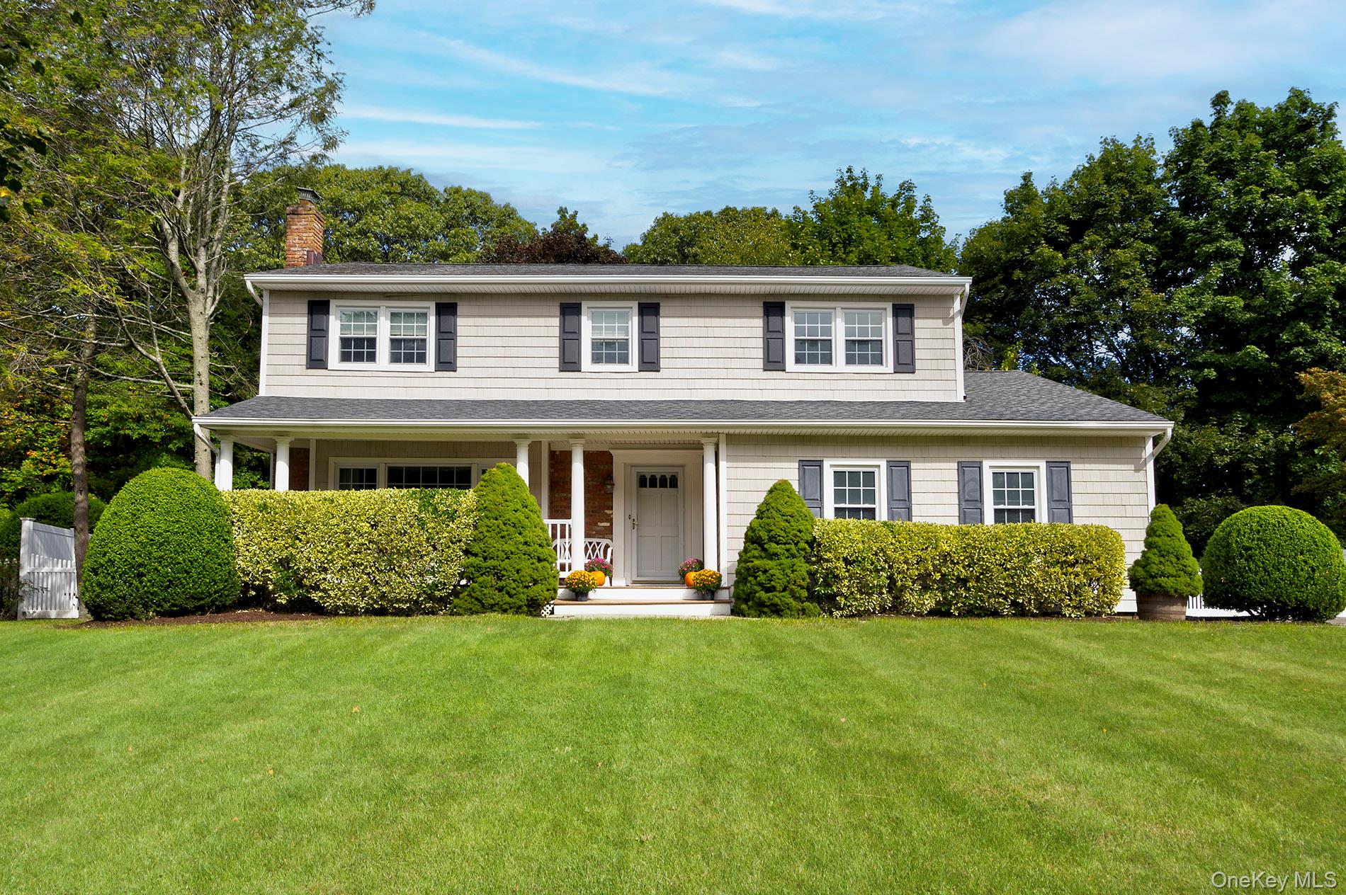A lovely, spacious colonial tucked in at the end of a secluded court, minutes from Huntington village. The home features all large rooms. Welcoming front porch, large formal living room with expansive front windows fill the home with natural light. The formal dining room off the big bright eat in kitchen; lofted breakfast area surrounded by windows overlooking the backyard, and sliders out to the deck. The large den/great room has a wood-burning fireplace, tray ceiling and 2 skylights; a wonderful space for family gatherings. Upstairs the primary bedroom has an ensuite bath and walk-in closet. There are also 3 more bedrooms and a family bath. Partially finished basement, 2 car garage enters in to the home. Private back yard. Hardwood floors up and down, crown moldings, gas fuel, CAC. Updated Heating System, Home Generator. Newer Windows, Siding & Roof. Enjoy everything Huntington has to offer: great parks and beaches, also endless shopping & dining options, and the LIRR station is nearby. Great location and potential. A forever home to plant roots and grow dreams.