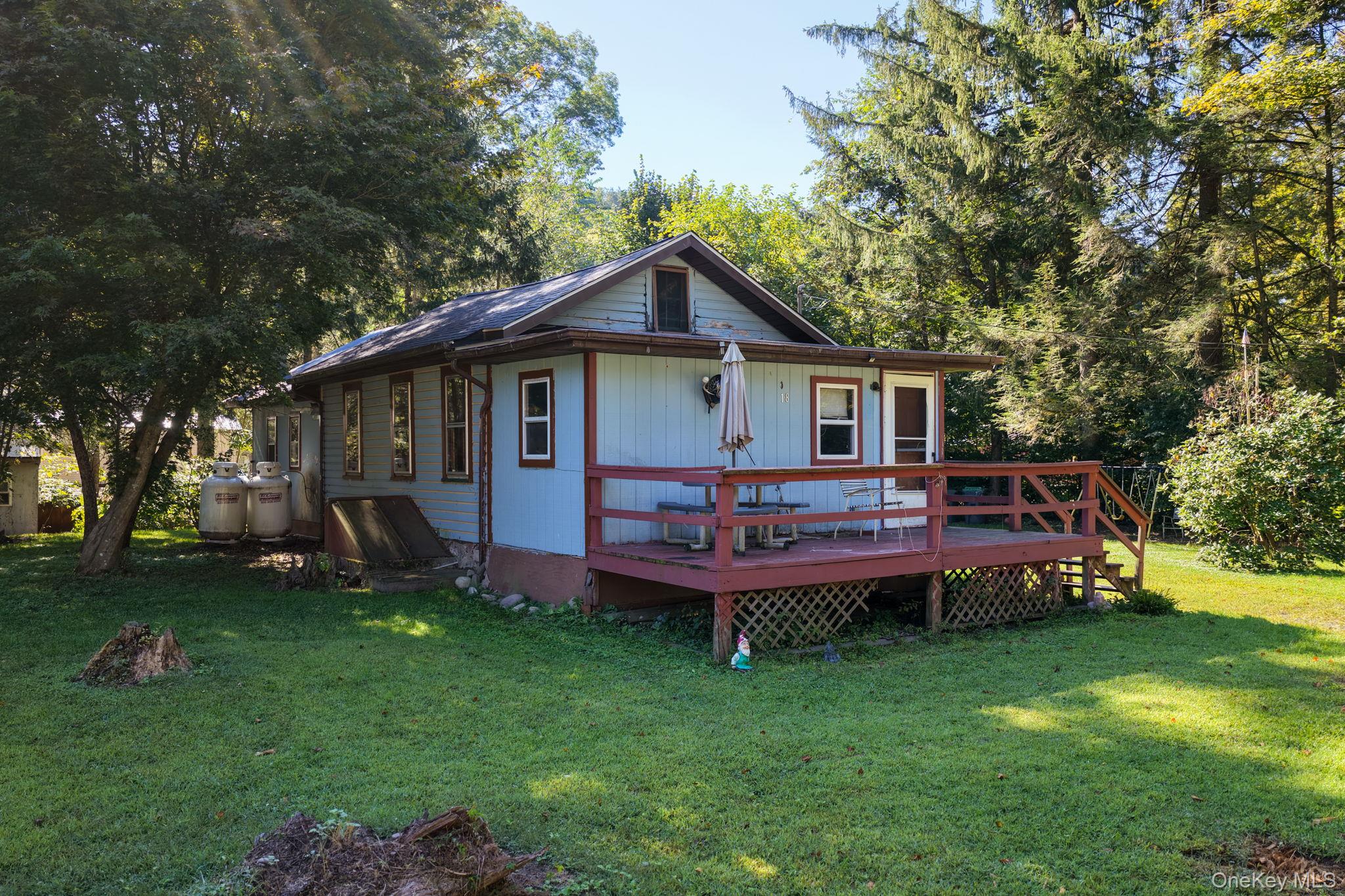 18 1st St, Goddefroy, NY â€“ Fixer-Upper in a Scenic Hudson Valley SettingWelcome to 18 1st St, a bungalow-style home located in the desirable Meyers Grove Community in the heart of the Hudson Valley. This 800+ sq ft home offers 1 bedroom, 1 full bathroom, hardwood floors, a quaint kitchen, an enclosed front porch, front deck, and a covered rear porch, all set on a .25-acre lot with a cleared yard and wooded privacy. Two storage sheds offer extra utility.While this property needs some TLC and updating, it has served as a cozy residence for years and presents a great opportunity for investors or handy buyers looking for a project with upside.Enjoy the peaceful, walkable neighborhood, just steps from the Neversink River, perfect for outdoor recreation. The home is also located just 10 minutes from the nearest train station to NYC, 15 minutes to downtown Port Jervis and the Pennsylvania border, and only a 90-minute drive to New York City.Living here means being surrounded by the best of the Hudson Valley â€” from hiking and biking trails, to local wineries, distilleries, and river adventures. With its great location and price point, 18 1st St is a unique opportunity to own a piece of the Hudson Valley lifestyle.
