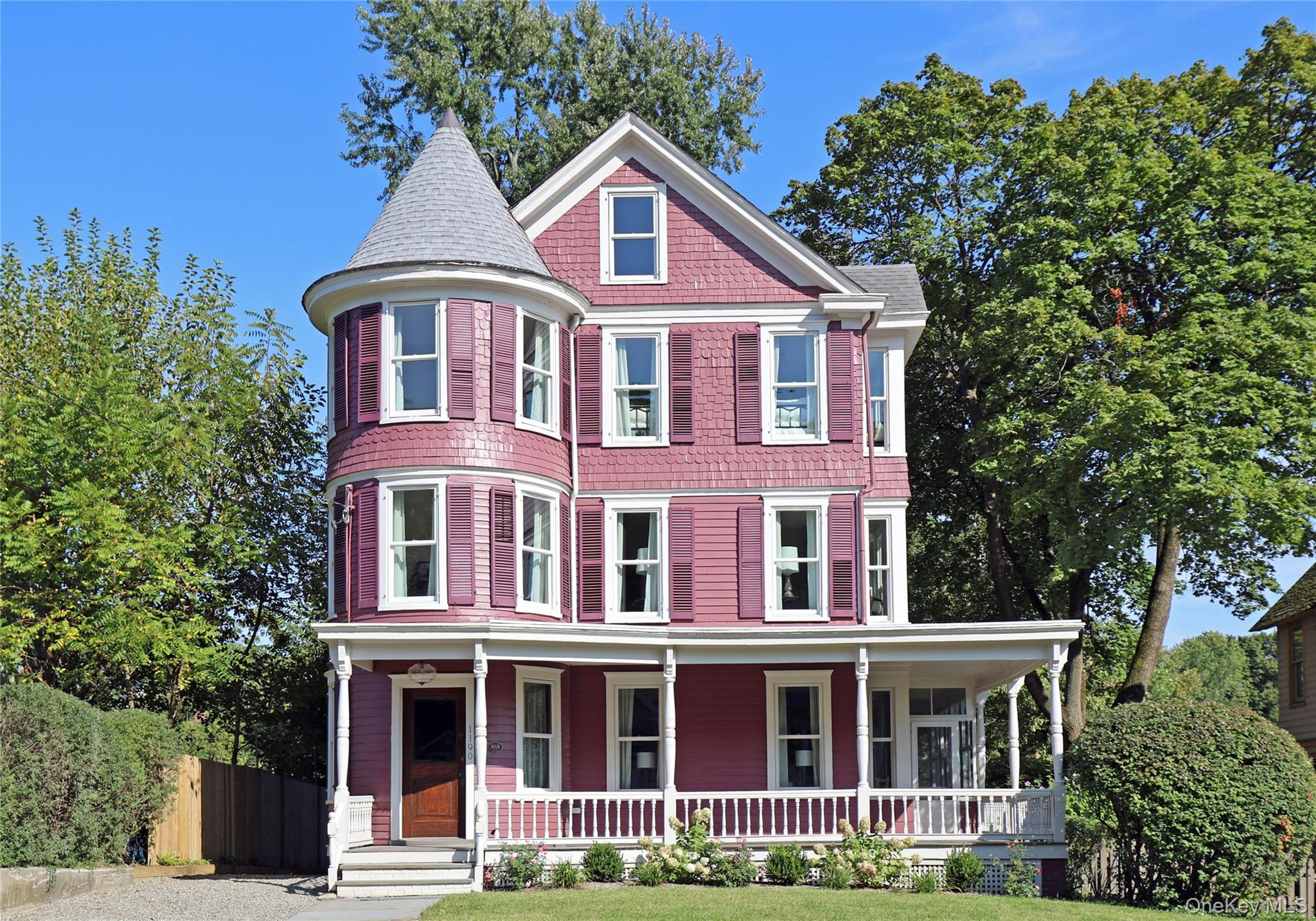 The Florence House  Contemporary Victorian EleganceStep into a piece of history with this extraordinary Victorian beauty, gracefully positioned in the heart of Beacon and offered for the first time since 1984. Built circa 1890, this remarkable three-story home has been lovingly owned by only three families throughout its storied existence, creating a rare opportunity to own a true gem. The Florence House is nothing but calm, elegant and timeless.Masterfully redesigned by Faust Design Build, this 2, 700 sqft residence represents the perfect marriage of historical grandeur and contemporary luxury. The thoughtful renovation honors the home&rsquo;s Victorian heritage while introducing modern conveniences that elevate everyday living. Offered completely turnkey and sold furnished, you can simply move in and begin enjoying upstate NY life immediately.As you enter the circular foyer, the stunning original oak paneling and staircase immediately takes you to a time gone by. The main floor showcases a stunning designer kitchen with beautiful white oak floors and MSI quartz countertops, complemented by an impeccable Portmore tile backsplash. The culinary centerpiece features brand-new stainless steel appliances, including a striking double-sided island perfect for preparation and casual dining. Thoughtful details like recessed lighting and custom cabinetry demonstrate meticulous attention to both form and function.The dining room serves as the perfect connector between kitchen, living room and family room creating seamless flow for entertaining. The dining room and adjacent living room captivate with their original parquetry white oak floors and wide windows that flood the space with natural light. A charming powder room featuring historical blue beadboard wainscoting adds upscale functionality.The second floor boasts beautiful original wood floors and houses the luxurious main bedroom with a large arched-top alcove that creates a light-filled sanctuary, and generous walk-in closet space. The main bathroom serves as a spa-like retreat with its wooden vanity topped with marble countertop housing two undermount sinks, a spacious walk-in shower with white herringbone ceramic tile walls, and white marble flooring. The piece de resistance is the stunning original white clawfoot bathtub that perfectly bridges historic charm with modern luxury. Another peaceful bedroom features sage green board and batten with toile wallpaper. The home&rsquo;s distinctive turret houses a bright office space, offering the perfect retreat for work or contemplation.The third floor expands versatility with two generous but cozy bedrooms and full bathroom featuring vintage vanity set against striking geometric floor tiles. The third-floor turret creates an ideal children&rsquo;s playroom or nursery.Set on an expansive 7, 405 sqft lot, the property boasts mature landscaping including original brick patio and bluestone pathways, complemented by stone benches and stunning trees like Japanese cherry and redbud alongside abundant perennials. The wraparound porch, complete with enclosed sunroom, provides a perfect setting for leisure. A private deck accessible from the kitchen offers ideal entertaining space with stairs leading to the backyard&rsquo;s secret garden, while the detached original carriage house could serve as studio space.Comprehensive renovation includes all new plumbing, HVAC, and electrical systems, plus premium Delta fixtures, new Andersen windows, and roof, ensuring worry-free ownership. Second-floor laundry adds practical luxury.Located minutes from Beacon&rsquo;s Main Street and Dia: Beacon museum, one block from country club/golf course with Metro-North access three minutes away and Manhattan 90 minutes south. The Florence House represents more than a homeâ€”it&rsquo;s your gateway to the dreamy Hudson Valley lifestyle, complete with every furnishing already in place.