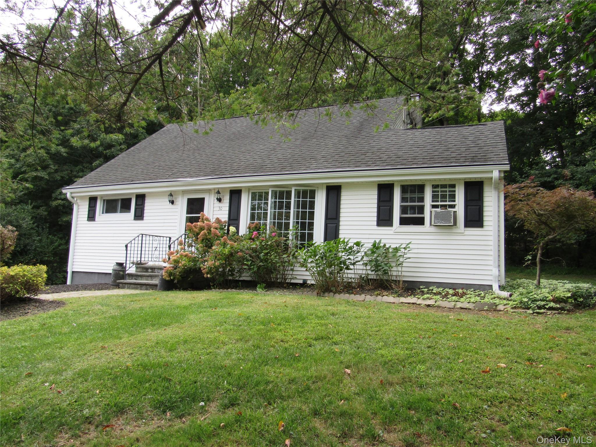Beautifully updated 2 bedroom Cape Cod home in walking distance to the village of Goshen. This lovely home features a sunny open concept Living Room and renovated Kitchen with hardwood floors and SS appliances. An extra wide hallway leads to 2 nice sized bedrooms and a renovated Bathroom with beautiful tub/shower with marble and porcelum floors. There is also a much sought after Home Office with cathedral ceiling and plenty of natural light. There is a walk up 2nd floor for plenty of storage space. Lush landscaping and block walkways led to a very private rear yard with flagstone patio. Close to shopping, restaurants and parks. Great commuter location>