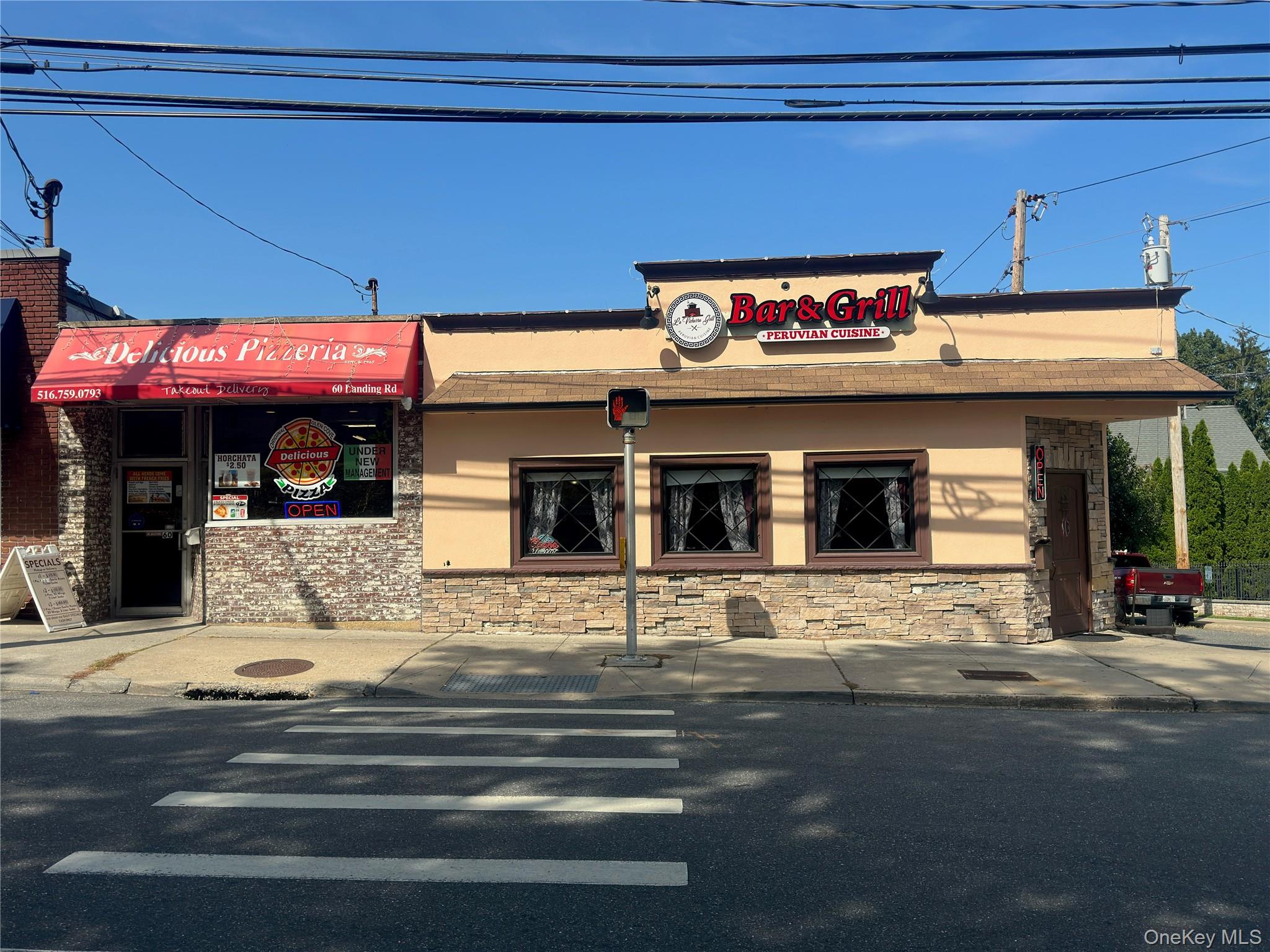 Opportunity knocks with this fully leased two-unit commercial property located at the prominent corner of 58â€“60 Landing Road in Glen Cove. Featuring a 640 sq. ft. pizzeria and a 3, 040 sq. ft. bar and grill, this property offers investors stability, visibility, and long-term growth potential.Both tenants are responsible for their own utilities and property maintenance, minimizing landlord obligations. Ownership responsibilities are limited, making this an attractive low-maintenance asset.Highlights include:Fully leased with established tenantsCentral air and heating in both unitsExpansive 2, 432 sq. ft. basement with walk-in cooler beneath the restaurantPrime corner location with excellent visibility and convenient parking5.6% cap rate at $1, 000, 000 asking priceThis is a turnkey, income-producing investment in a thriving Long Island market. Perfect for those seeking a stable return and long-term value.