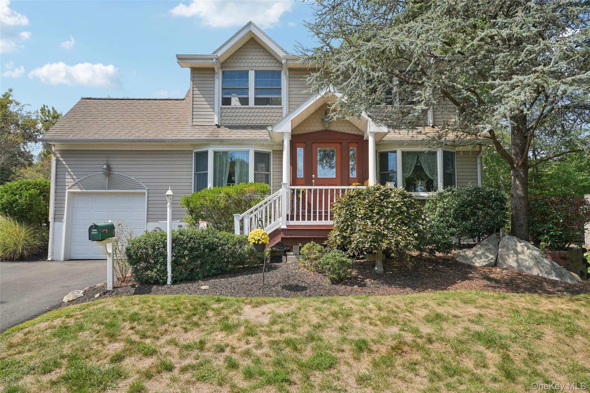 Welcome to Kent Street! This beautifully maintained unique 3 bedroom, 2 bath Cape Cod style home with finished dormer sits pretty on a picturesque corner lot. Located in a sought after neighborhood just 30 miles north of Manhattan in the Award Winning Clarsktown School district. Prime location just minutes to shopping, public transportation, parks, and scenic trails. Renovations have preserved its classic charm yet while creating a modern flair feel, with vaulted ceilings, skylights, and abundant natural light throughout. Bright and welcoming, it features hardwood floors on the first floor and upstairs hallway, custom molding, recessed lighting, and a spacious living and dining room with bay window. A convenient first floor bedroom or perfect home office adds comfort and flexibility. The eat-in kitchen with sliders opens to a 3-tier deck and great level serene yard, just perfect for entertaining! Upstairs boasts a beautiful oversized bathroom with jacuzzi tub, separate shower, skylights and even a heated towel rack. Two additional large bedrooms offer both comfort and style with expanded full height ceilings and skylights. A one car garage also with high ceiling, full unfinished walkout basement with storage galore, updated siding, new interior doors as well as front door, water heater, refrigerator and washer/dryer. Even has a gas line for grilling that adds convenience as an added perk as well as an oversized 12X10 shed. Additional bonus: redone driveway with plenty of parking. Pride of ownership shines through and through in this very comfortable warm move in ready delight of a home. Itâ€™s just waiting for you to call it home!!