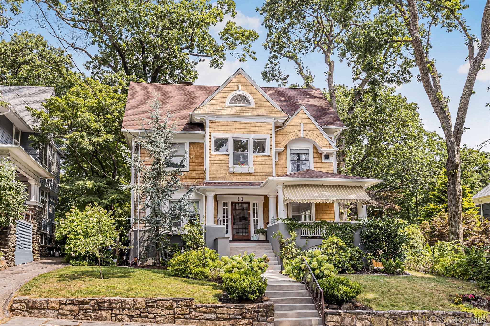 Welcome to this stunning, spacious Victorian Home in Historic Park Hill filled with charm, character and plenty of natural light. Fabulous covered front porch leads you to gracious front entry. Center hall foyer immediately welcomes you to center stairway and pocket door entry to both living room and formal dining room. Enjoy lazy days and cozy nights in front of the wood burning fireplace complete with original built-ins. Formal dining room is perfect for all gatherings and boasts original wainscoting detail. Custom kitchen island offers built-in bench seating, five star gas range, bosch refrigerator and granite countertops. Easy access to open air deck and lovely natural landscaped gardens. Powder room/laundry area completes this level. Second level features Primary bedroom, 2 add&rsquo;l bedrms, home office and renovated full bath. Third level offers 2 additional bedrooms, home office and claw tub full bath. Hardwood floors throughout. Work room, utilities, and plenty of storage on lower level. Spacious open air deck overlooks beautiful level rear yard boasting mature trees and perennial blooms. Fenced Yard, Central Air. Extra side lot included.