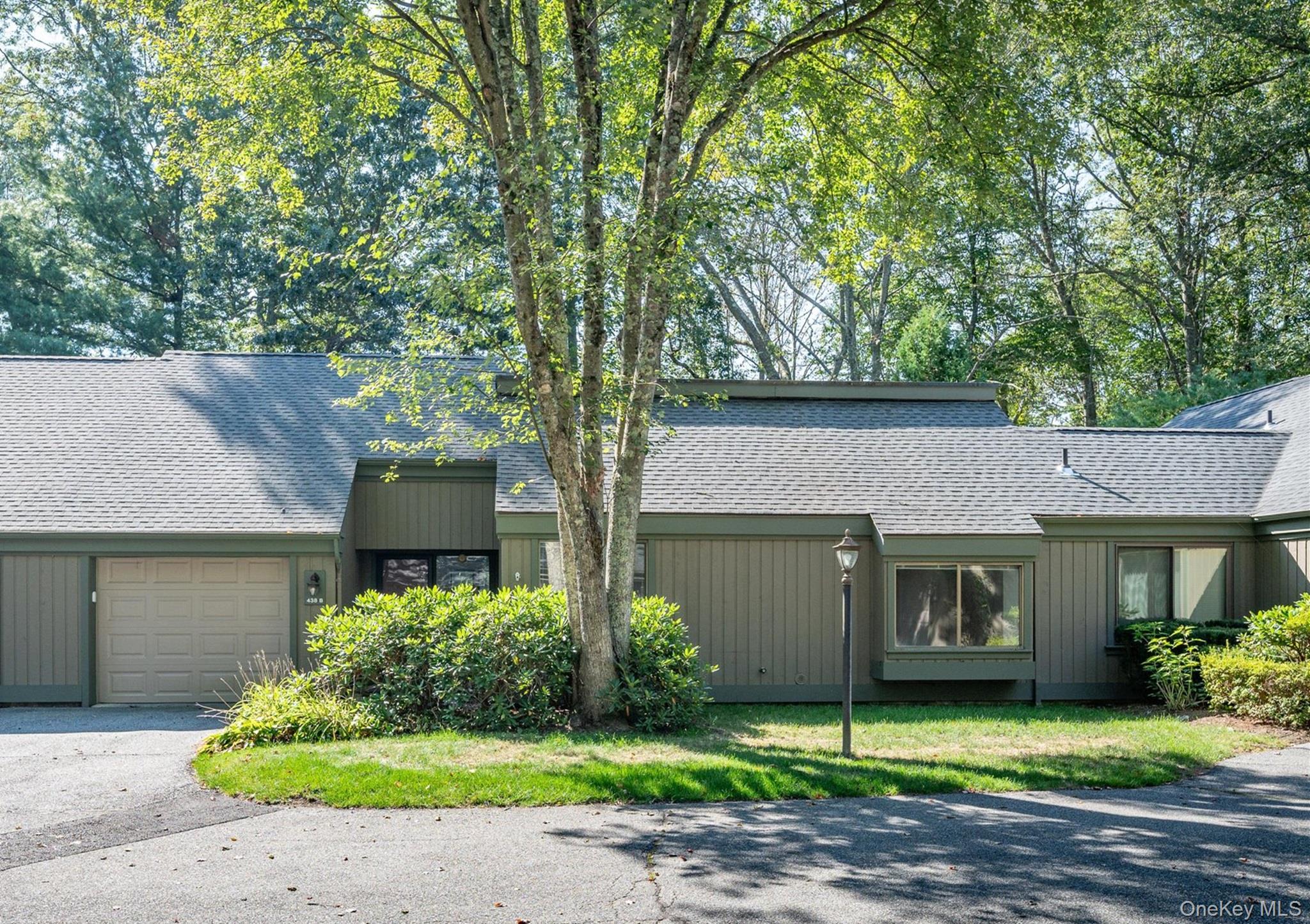 Highly desirable Stratford Model. One-level living at its best with zero stairs features 2 spacious bedrooms, 2 full bathrooms, and a bright open layout. Step out onto the brand new wood deck with stairs leading to a private backyard, perfect for relaxing or entertaining. Recent updates include new wood flooring, new deck, new HVAC system, new dryer, thermostats, electric baseboard heaters, and faucets. A one-car attached garage and plenty of guest parking at the courtyard entrance provide added convenience. Residents enjoy resort-style amenities including five swimming pools, tennis and pickleball courts, fitness and activity centers, walking trails, library, 24-hour security with EMS, and a variety of clubs and activities. Shuttle service to Metro North and the town shopping center makes this a truly easy lifestyle to enjoy.