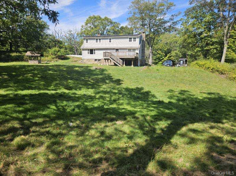 Nestled on 1.3 acres of private property not far from the village of Monroe, this home features a oversized living room with rustic stone fireplace with pellet insert! Eat in kitchen with doors to private deck! Full bath and another room with second rustic stone fireplace - hook up for washer dryer. On the second level there are 5 bedrooms, original hardwood flooring - master has wall to wall walk in closet. Full bath off the hallway! The grounds are private and spacious! There is access to Lake Balder where residents can swim etc for a fee of $30/year.