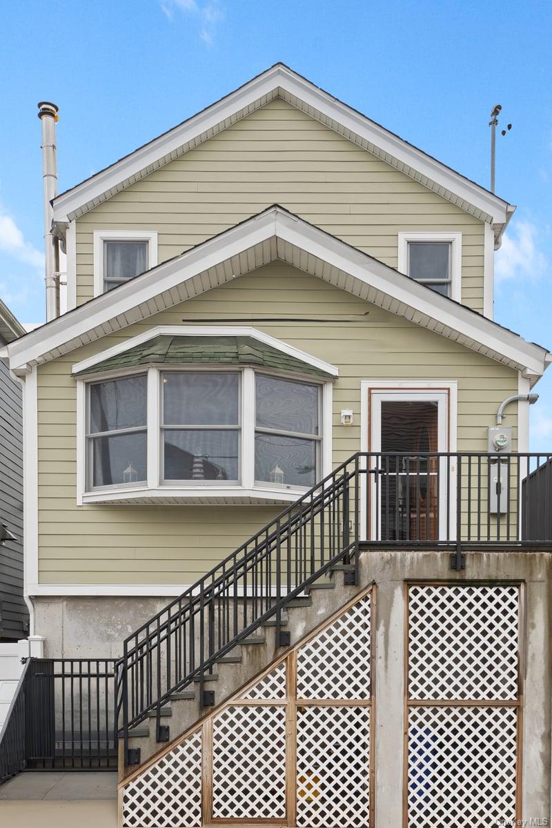 Move-In Ready Gem in Broad Channel. Welcome to this beautifully maintained and fully move-in ready raised home, perfectly located in Broad Channel. Step into a spacious living room featuring gleaming hardwood floors, skylights, recessed high hat lighting, a cozy wood-burning fireplace, ceiling fan, coat closet, and a split air conditioning unit for year-round comfort. The updated kitchen is a chefâ€™s dream, equipped with Energy Star-rated stainless steel appliances, oak cabinetry, stunning quartz countertops, and a classic tiled floor. Adjacent is the bright dining area with tiled flooring, a ceiling fan, split A/C, and charming French doors that open to the backyardâ€”perfect for indoor-outdoor living. The main floor also offers a convenient laundry room and a stylish half bath. Upstairs, youâ€™ll find bedrooms with hardwood floors, split A/C units, and a full tiled en-suite bath off the primary bedroom. A dedicated home office space provides added flexibility for remote work or study.Additional highlights include: Fully finished attic with electric and a plywood floorâ€”ideal for storage, Enclosed under-house area with cement flooringâ€”perfect for a workshop, gym or extra storage, Sprinkler system throughout, Large fenced backyard with pavers and a spacious storage shed. This home offers comfort, space, and convenience in a desirable location close to city transit, nature, and the beach. Donâ€™t miss your chance to own a turn-key property with everything you needâ€”and more.Just 15 minutes from JFK Airport and steps from the train, express bus to Manhattan, shops, Rockaway Beach, and Gateway National Park.