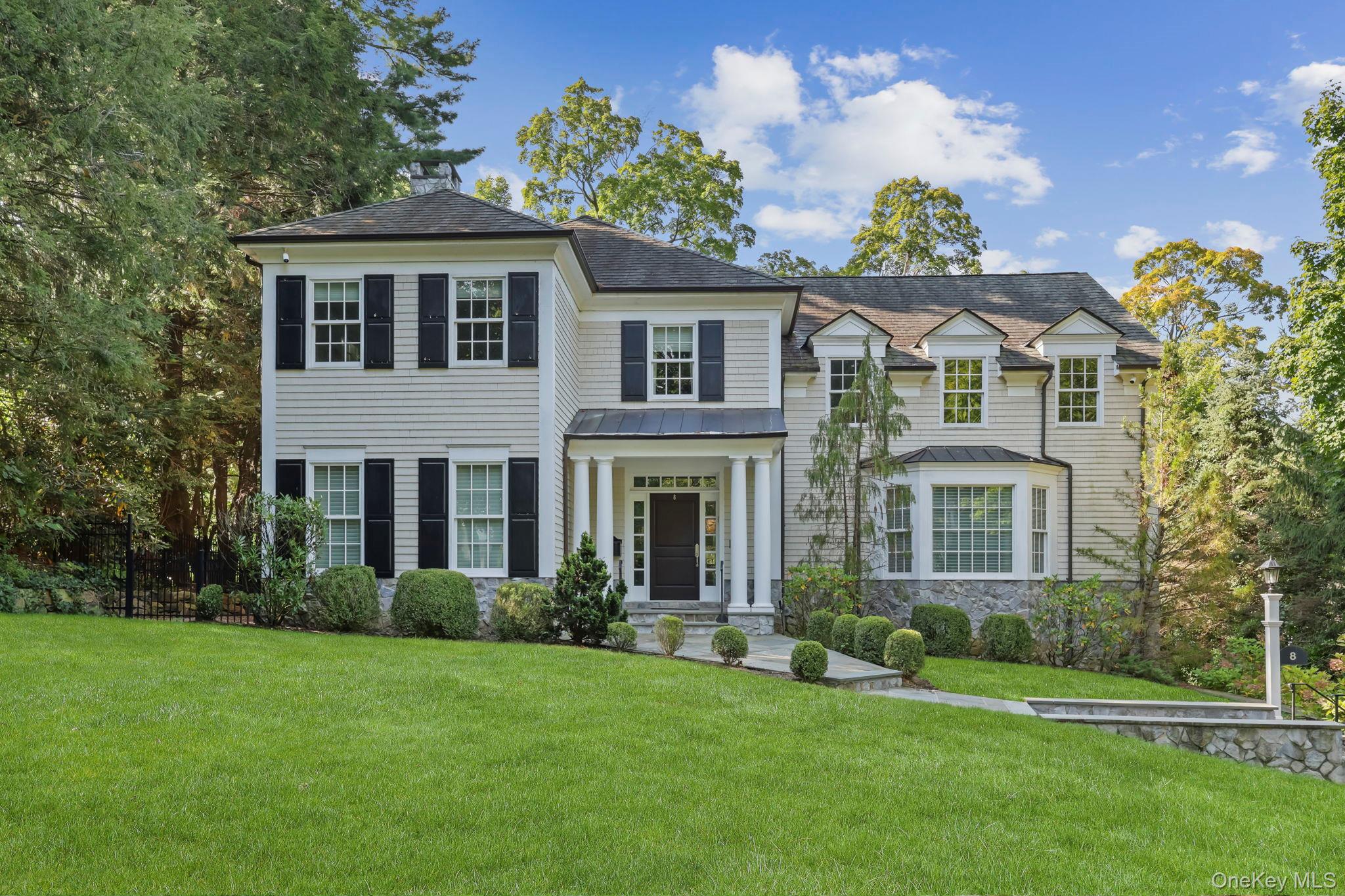 Fall in love with this young Colonial in the heart of Fox Meadow, offering six bedrooms, five-and-a-half bathrooms and over 7100 square feet of living space. Built in 2004, this thoughtfully designed home blends classic architectural details with the comforts of modern living. Large windows let in an abundance of sunlight throughout the day and the refreshed eat-in kitchen with new countertops and new backsplash connects seamlessly with the Family Room complete with two sets of French doors that lead out to the newer Trex deck and lush backyard - this is where you will gather with family and friends for entertaining, holidays and cozy nights in by the fireplace. Other features include high ceilings, custom millwork, mahogany library with ventilation system and fireplace, new fence, tech system upgrades including fiber, new hot water heater, repaved driveway with stone apron, ample storage, two new heating/AC units, and more! The second floor features a total of five bedrooms on one level including a sunny primary suite with tray ceiling and fireplace, complete with outfitted walk-in closets and a spa-like master bathroom. Four spacious additional bedrooms include two with en-suite baths and two connected by a Jack-and-Jill bath, providing flexibility and privacy for loved ones or guests. The fully finished lower level expands the homeâ€™s living footprint, including a recreation room, infrared sauna, gym, and bedroom with full bath. Additional features include a nice three-car garage, central sound system, and a 36kw whole house generator with new gas line. Set on a tranquil street on nearly 0.40 acres of lush property, the private backyard is fully fenced with plenty of room for a trampoline, playset or firepit. Ideally located, its an easy walk to Fox Meadow Elementary School, Scarsdale High School, the Scarsdale Library, Scarsdale Village shopping and restaurants and the Metro-North train to New York City. Experience the comfort, convenience, and timeless style of this quality property!