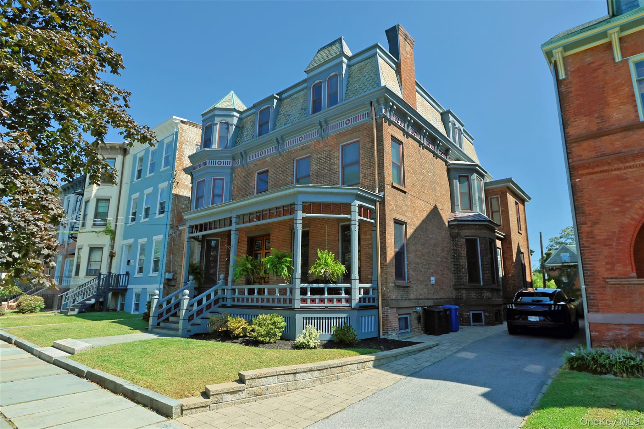 Absolutely Stunning brick Second Empire Victorian Mansion w/beautiful Hudson River Views! Located just 60 miles from NYC, this 1884 architectural treasure (on the National Register of Historic Places) is remarkably original, yet has the modern upgrades that make it a pleasure to live in today. Whether you are enjoying the Hudson River views from the west side of the home, enjoying the view of the other historic homes from the east side of the home, or enjoying delicious details, craftsmanship & gracious spaces inside the home, there is ample eye-candy to keep you satisfied. This is a home that really needs to be experienced in person to be fully appreciated. It was designed by Architect Elkanah Shaw (whose family also produced all of the millwork for the home) for one of Newburgh&rsquo;s economic leaders of the day (see the last listing photo) - and as director of the Edison Electric Illuminating Company in Newburgh, Shaw worked with Thomas Edison to electrify the home during its construction (one of the very 1st homes in the world to be built with electrification). The quality of construction is strikingly evident throughout: detailed plaster work, high quality & highly-detailed millwork, basement brick walls supporting all interior walls above them, 5 interior staircases, 7 fireplaces, gorgeous front & rear porches, etc. Modern upgrades include: 200A electric system, modern plumbing, modern gas boiler, appropriately updated bathrooms & kitchen, refurbished box gutters & EPDM membrane top roofs (w/light grey silicone coating), & over 50 new double-paned architecturally-approved windows, to name a few. The interior spaces are spacious but still warm & inviting. The central hall floor plan provides a logical and comfortable flow, especially on the 1st floor - making entertaining (even large events) a pleasure. In addition to the primary bedroom suite, with its own full bath and full-room walk-in closet/changing room/laundry (with river views), there are 8 other bedrooms w/closets to use however you wish. Some are currently used as home office space, a media room, and extra family room, etc. The basement is has the same layout as the 1st floor & includes a well-equipped gym. The Kitchen retains its mid-century cabinetry & has new stainless appliances, ample pantry closets, and its own staircase leading to a full pantry room with a 2nd freezer. The 2-story rear porch & rear patio/yard are also great for entertaining - or just enjoying a quiet meal or morning coffee while enjoying the river view! There&rsquo;s also garden shed in the backyard w/lights & outlets to keep things charged. The driveway can support 3 cars & features a 50A outlet for a stage 2 car charger. It&rsquo;s easy to see why this home has appeared in several films and television shows over the past 10yrs. So many similar urban homes from this era were either demolished (during the destructive period of urban renewal of the late 1960s to early 1980s) or cut up into apartments over the years. This one managed to remain owner-occupied since its construction, and has survived, fully intact. No small feat! Walkable to mass transit, library, dining, shopping, waterfront, parks, etc. Newburgh was the taste-making center of the 19th century and is renowned for its beautiful 19th century homes - this is your chance to own one of the very best of them that still exists. A very rare opportunity, indeed. (more historical/home info available upon request)