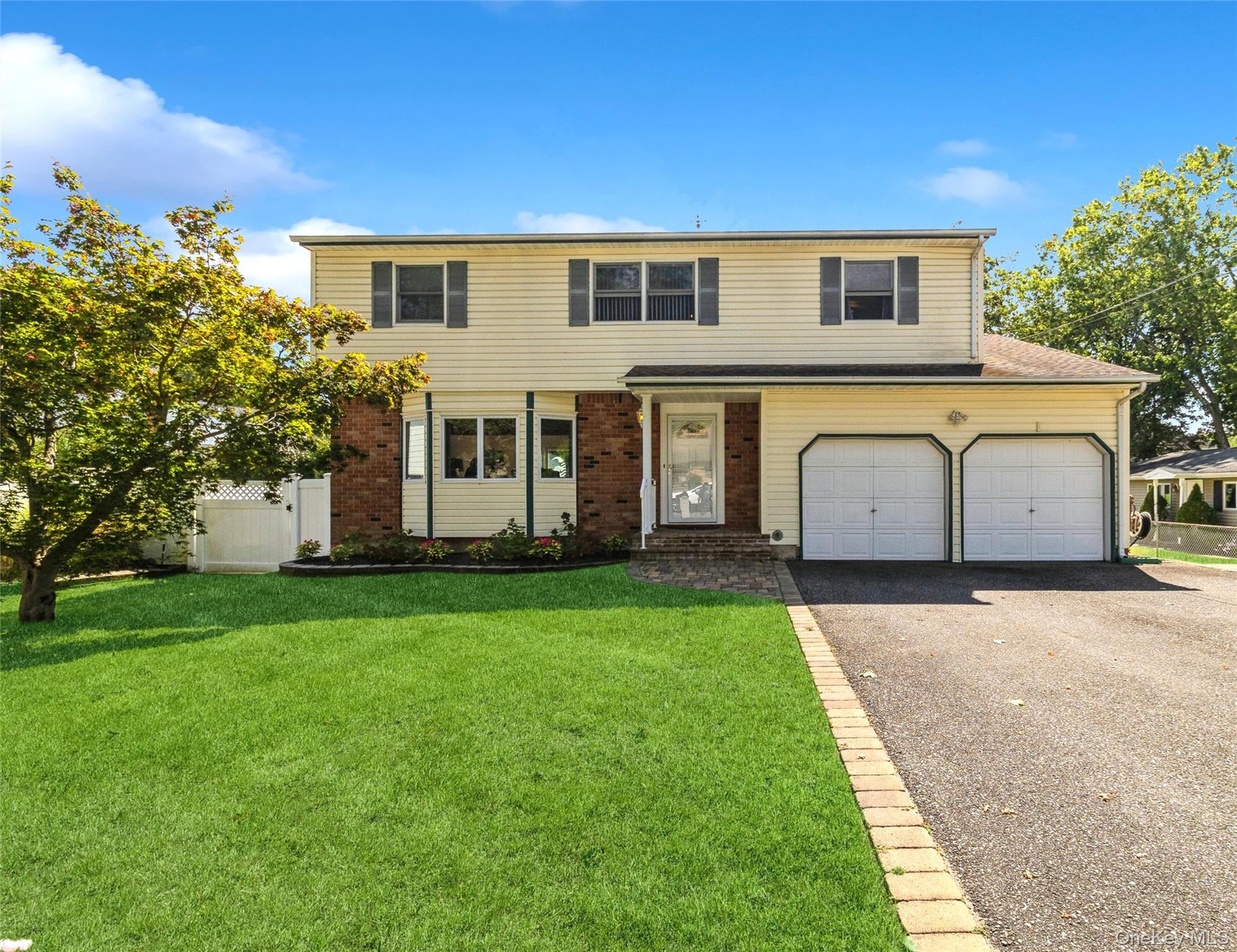 This Very Welcoming 5 Bedroom 3 Full Bath Colonial Home is located in the Lakeland Area of Ronkonkoma, Connetquot Schools. Many, Many Updates, MAINFLOOR: Entrance Foyer, Formal Living Room with Split System AC, Large Eat-in-Kitchen with Oak Cabinets and Wrap-around Corian Counter includingBreakfast Nook, Overlooking Formal Dining Room with Sliders out to Paver Patio with Outside Kitchen including BBQ, Refrigerator, Wet Bar. With amazing View of Huge Flat Back Yard. Main Level also has 2nd Primary Bedroom or Playroom, Large Den with Wood Burning Fireplace has Energy Efficient Insert, Full Bath, Large Sliding Doors looking out to Decking and Yard. This area also has Privacy Pocket Door Separating it from main house, can be a Great Nanny or In-lawQuarters. SECOND FLOOR: 4 Very Large Bedrooms Including Huge Primary Bedroom with Update Full Bath, New Full Bath in Hallway. BASEMENT: Finishedincluding 7-year-old Boiler and laundry rooms. This Home Has Mostly Hardwood floors throughout. Newer Carpets. High Hat Lighting, Ceiling Fans, FreshlyPainted, Newer Windows including Casement Anderson, Updated Roof, 200 Amp Electric, 6 Car Driveway with Paver Apron.