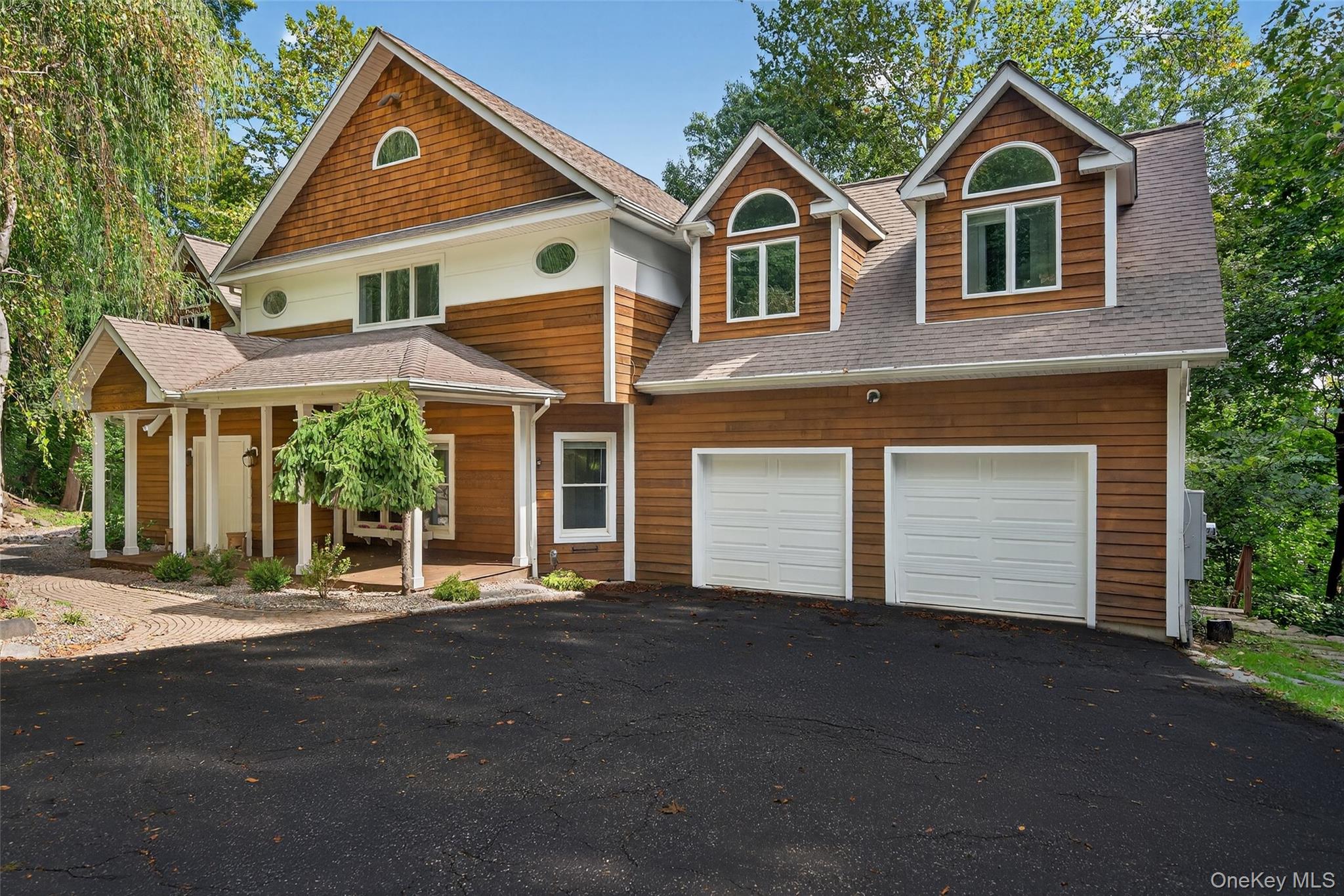 Located in the sought-after South Orangetown School District, this stunning 4-bedroom, 3.5-bath home sits on a quiet dead-end street in the picturesque Village of Piermont. Just 15 miles north of the George Washington Bridge, the home offers quick access to New York City and a range of convenient commuting options. Enjoy seasonal Hudson River views and direct access to the Raymond G. Esposito Memorial Trail for the outdoor enthusiast, which connects to over 8 miles of scenic, off-road paths via the Old Erie and Joseph B. Clarke Rail Trails. Inside, the home features hardwood flooring and a dramatic double-height ceiling in the family room, creating an airy ambiance filled with natural light. A wood-burning fireplace adds warmth and charm to the main living area, while the expansive deck offers seamless indoor/outdoor livingâ€”ideal for entertaining or unwinding in a peaceful setting. The primary bedroom ensuite offers a true retreat with custom-built walk-in closets and a spa-inspired bathroom. The lower finished level of roughly 730sf included in the total includes a full bathroom and summer kitchen, perfect for guests or multi-generational living. A walk-up attic provides excellent storage or potential for future expansion, and a two-car garage with electric car charger ensures added convenience. A standout feature of this home is the brand new, $80, 000 geothermal heating and cooling system, offering exceptional energy efficiency, consistent comfort, lower utility costs, and eco-friendly operation. Just a short walk into the heart of Piermont, you&rsquo;ll find upscale restaurants, vibrant nightlife, quaint coffee shops, and art galleriesâ€”all framed by the beauty of the Hudson River. With its prime location and blend of modern updates and historic charm, this home truly offers the best of Rivertown living in Rockland County.