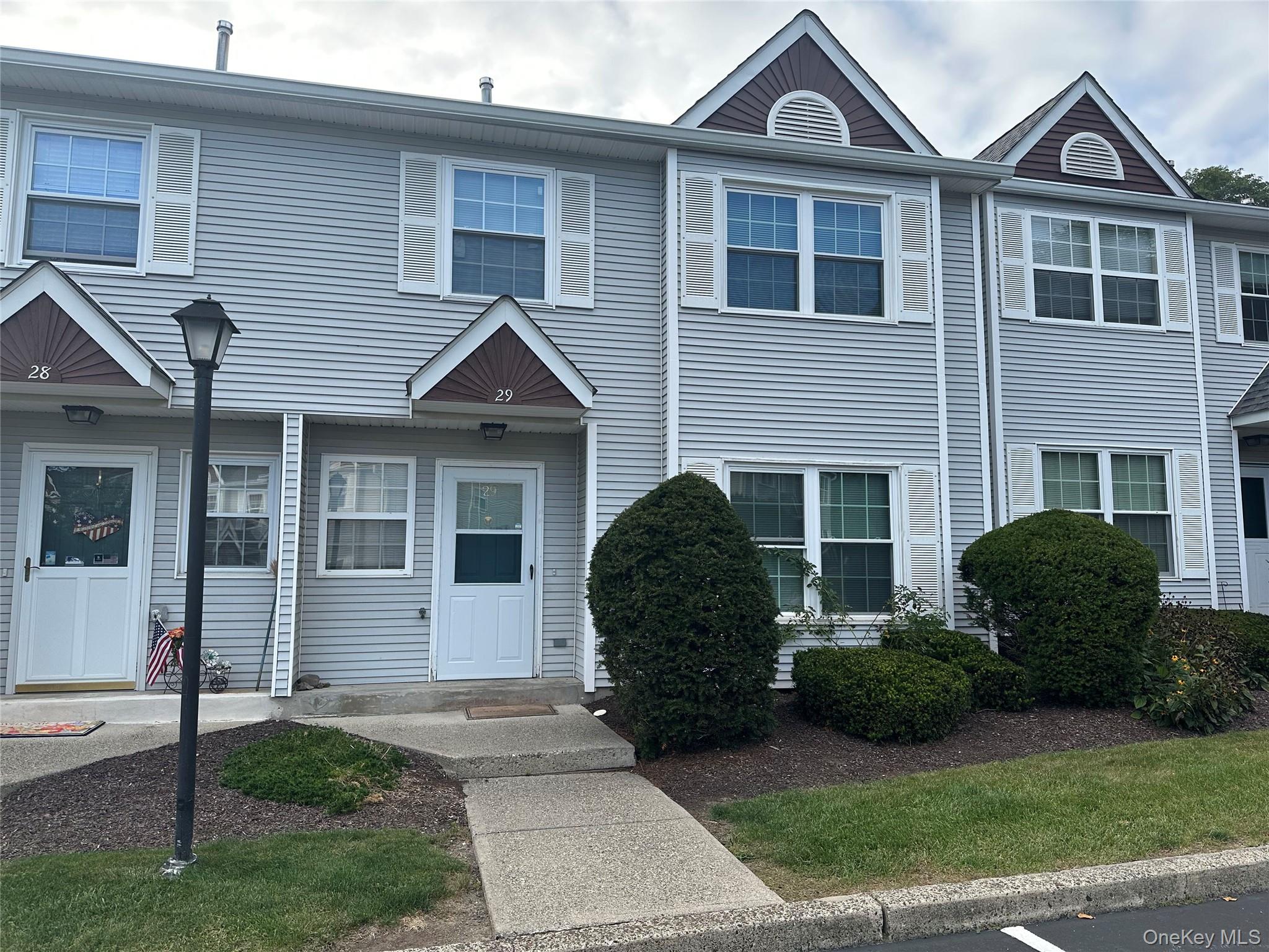 Enjoy easy living in this centrally located, spacious, 3 bedroom 2.5 bath condo. Newer tiled floors on 1st floor, newer bathroom vanities, sinks, lighting, hot water heater. Washer/dryer in unit. Primary bedroom ensuite with large walk-in closet, private bathroom. Sliders to patio from dining room, plenty of closets for storage. Close to highways, shopping, schools + two parking spots right in front of unit.