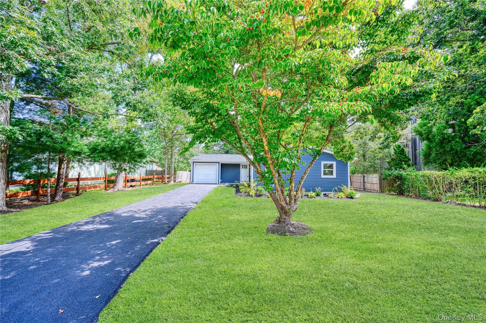 Welcome home to your newly renovated 4-bedroom ranch on a quiet tree lined street! This home is located in the Eastport- South Manor school district. This move-in ready home blends modern style with comfortable living, offering a bright and airy open floor plan filled with natural light. This home features vaulted ceilings, new kitchen with shaker cabinets, quartz countertops, stainless-steel appliances and CAC. There is a stunning bath with modern finishes. Spacious living and dining areas with wide plank light oak flooring and full basement. All new driveway, siding, roof and windows. The backyard is perfect for entertaining, gardening, or adding a pool. Close to beaches, parks, shopping, and LIRR.