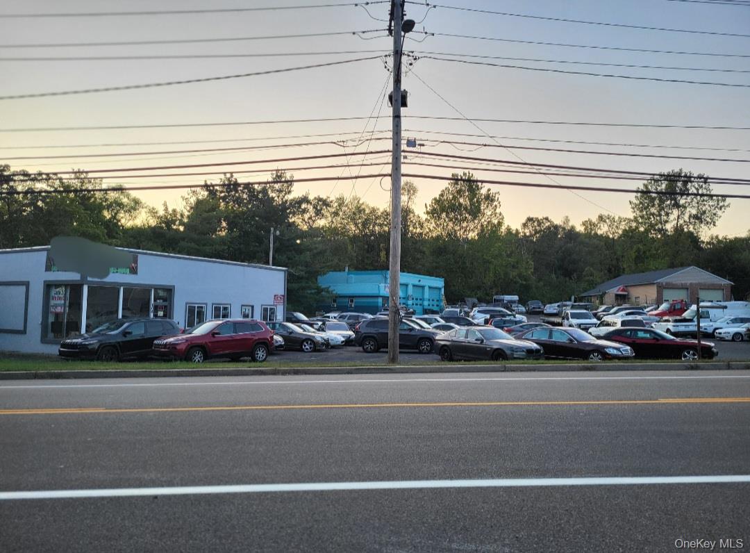 Commercial Mixed-Use Property on 2 Acres â€“ Auto Sales, Service & Residence in New Windsor, NY!Listed uses on the stamped site plan include Auto Sales, Used Auto Sales, Leasing, and Financing. Auto Repair, Auto Wholesale, Recovery, Prep. and Residential.Exceptional opportunity to own a mixed-use auto business on two acres of prime commercial real estate in a high-traffic location, with a 14, 000-car-per-day traffic count! The property features four separate buildings, all updated with C/O in 2023. Building 1 â€“ Auto Sales (1, 161 sq. ft.): Sales office with conference room, additional office, ADA-compliant bathroom, large windows, and some inventory. Parking for approx. 70 vehicles. Building 2 â€“ Auto Mechanic Garage (2, 088 sq. ft.): Three bay drive-in doors, office, bathroom, waiting area, and three lifts (15, 000 lb. and two 10, 000 lb.) Building 3 â€“ Auto Body Shop (1, 816 sq. ft.): Office, reception area, and body shop space with parking for approx. 35 vehicles. Building 4 â€“ Residence (676 sq. ft.): Two-bedroom, one-bath home with unfinished basement, electric and propane utilities. Additional highlights include Phase 3 electric, municipal water and sewer, natural gas, and fenced car storage/impound area. A turnkey, income-producing property offering auto sales, service, bodywork, and residential living in one location.