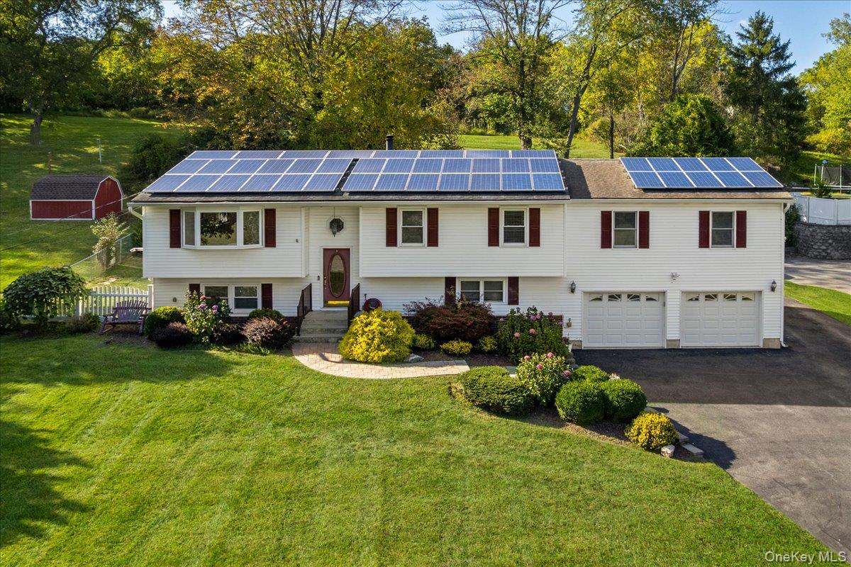 Your Hudson Valley Oasis Awaits â€“ 56 Daley Rd, Poughkeepsie, NYThis beautifully updated home offers the perfect blend of space, style, and convenience. The sun-filled main level features a living room with pellet stove, dining room, renovated kitchen with granite counters and stainless steel appliances, a four-season sunroom, plus five spacious bedrooms and an updated full bath.The walk-out lower level provides flexible living space with a summer kitchen, oversized bedroom with sitting area, updated full bath, and a living/dining area with direct garage accessâ€”ideal for extended family, in-law suite, or guest quarters.Step outside to your private retreat complete with an in-ground pool, deck, firepit, and seasonal water feature. Whether hosting gatherings or simply relaxing, this backyard has it all.Major updates include solar panels, central air, newer furnace, generator hookup, replacement windows, updated security system, and French drain making this a truly turnkey property.Nestled across from protected green space (soon to be an apple orchard), the home feels private while still being close to everything. Enjoy the Rail Trail, local farm-to-table restaurants and caf&#233;s, and shopping just minutes away. For commuters, the Taconic State Parkway and Metro-North are nearby, offering easy access to New York City and beyond.