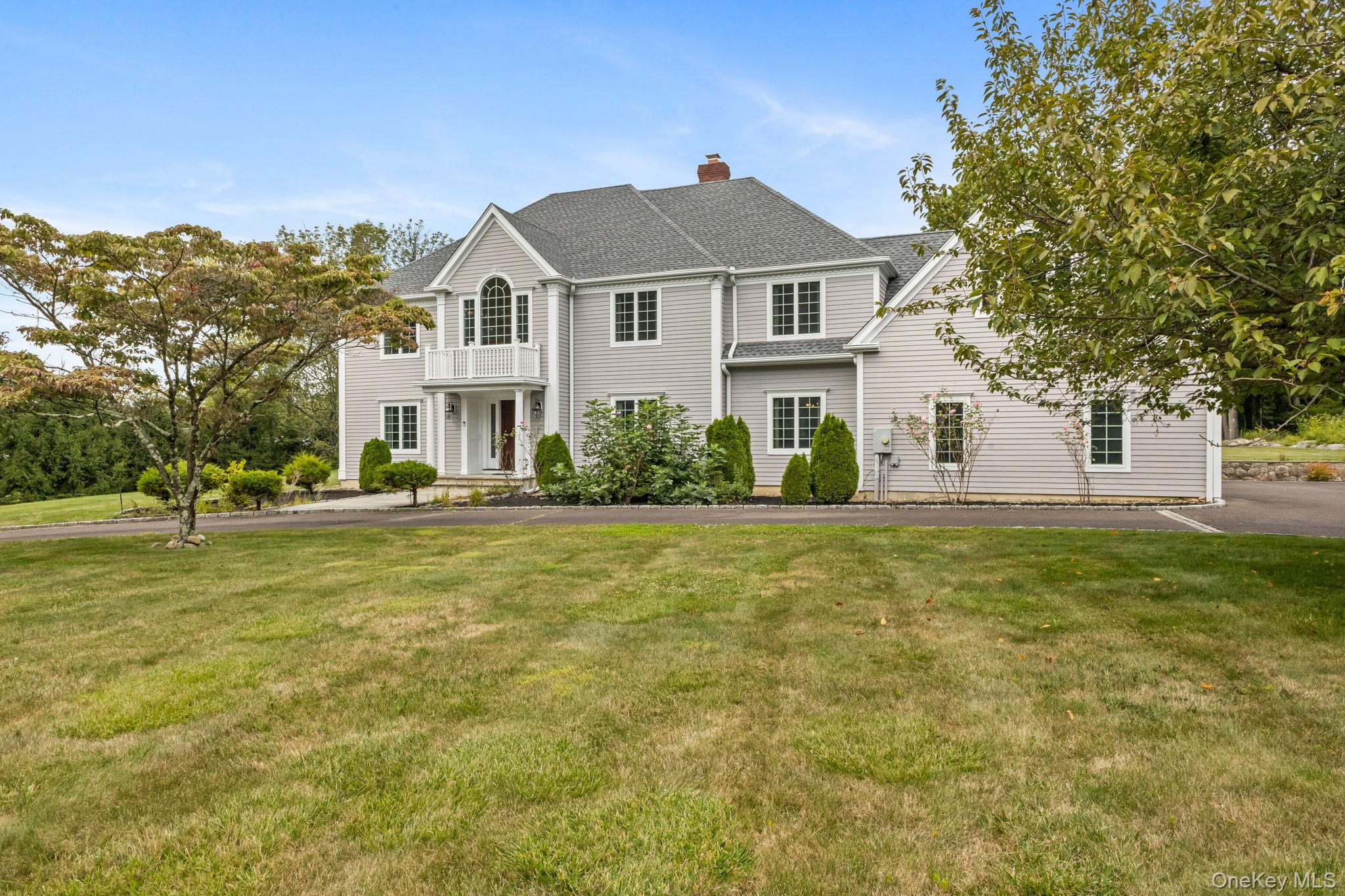 Don&rsquo;t Miss this Classic Colonial on 2 Acres Near Town - Quiet Cul-de-Sac Location! Set on a serene 2-acre lot on a sought-after cul-de-sac, this lovingly maintained 4-bedroom, 3-bath Classic Colonial offers timeless charm, abundant space, and unbeatable convenience just minutes from town. Inside, you&rsquo;ll find hardwood floors throughout, complemented by elegant granite flooring in the entrance/foyer, kitchen, and dining room-adding a touch of luxury to these central gathering spaces. The gracious formal living room, elegant dining room, and warm, inviting family room are perfect for entertaining or relaxing. The well-appointed kitchen opens to a screened porch that overlooks a flat, level backyard enclosed by long stone walls-providing exceptional privacy and a beautiful setting for outdoor living. There&rsquo;s also plenty of room to add a pool, making this backyard a true oasis with endless possibilities. A dedicated office and a cozy library provide flexible work-from-home options. The spacious bonus room over the 3-car garage is ready to be finished to suit your needs-whether as a playroom, studio, or guest suite. The full basement offers even more potential for expansion or storage. Other highlights include a whole-house generator, impressive curb appeal, and classic colonial detailing throughout. This is a rare opportunity to own a move-in-ready home with space to grow, custom built by the original and sole owner - in a highly desirable location. Note: Wet bar in family room is disconnected.