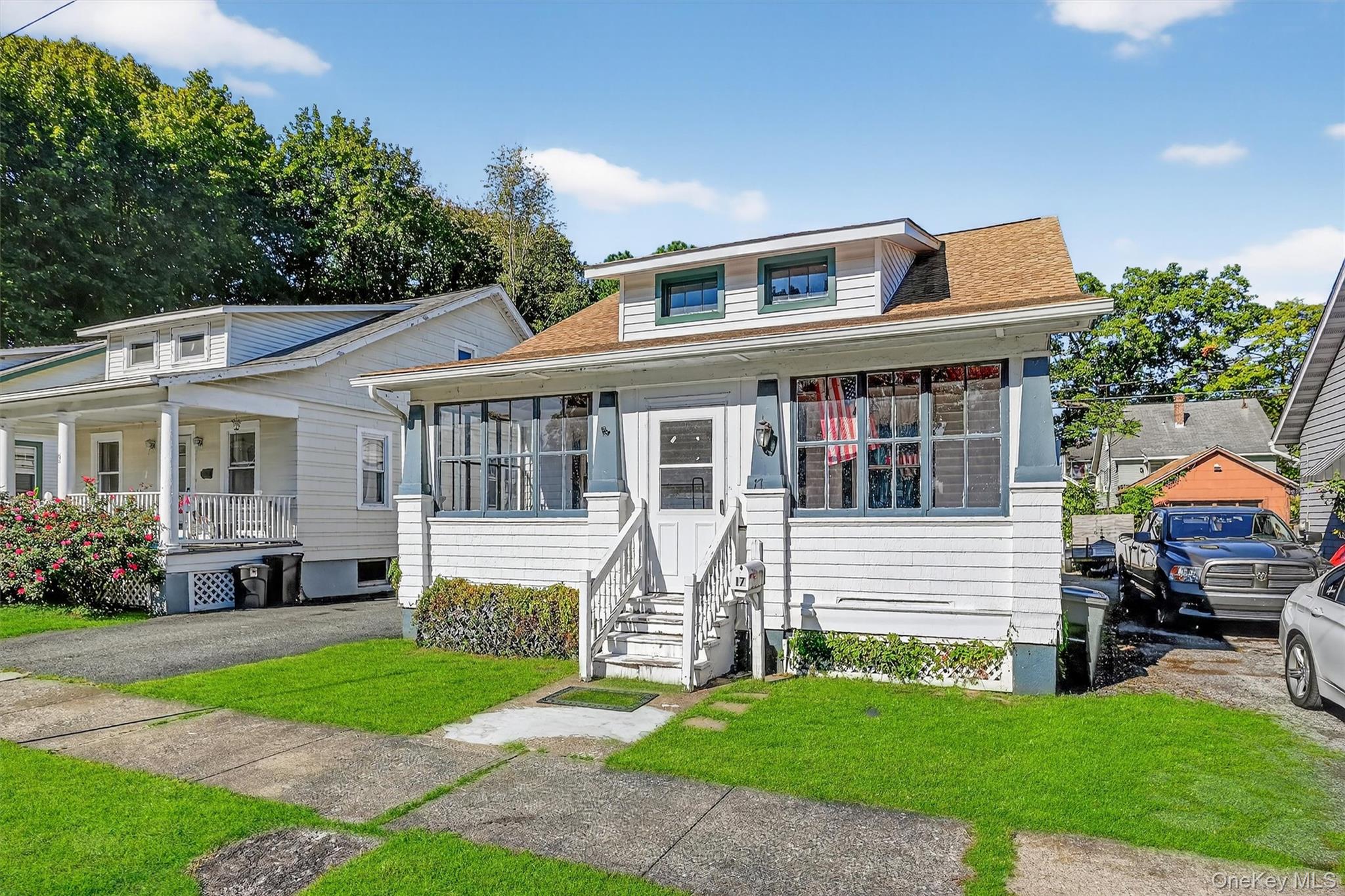 Tucked away on a dead-end street in the City of Newburgh, this charming 1930s two-bedroom bungalow is brimming with potential. Step inside to find timeless chestnut woodwork and hardwood floors. The layout offers a cozy living space and an inviting atmosphere. The attic offer potential for additional living space. Outside, a quaint backyard is perfect for gardening or relaxing, complete with a one-car garage for storage or parking. Whether youâ€™re an investor seeking your next project or a first-time buyer ready to create a home of your own, bring your vision and make this adorable home shine.