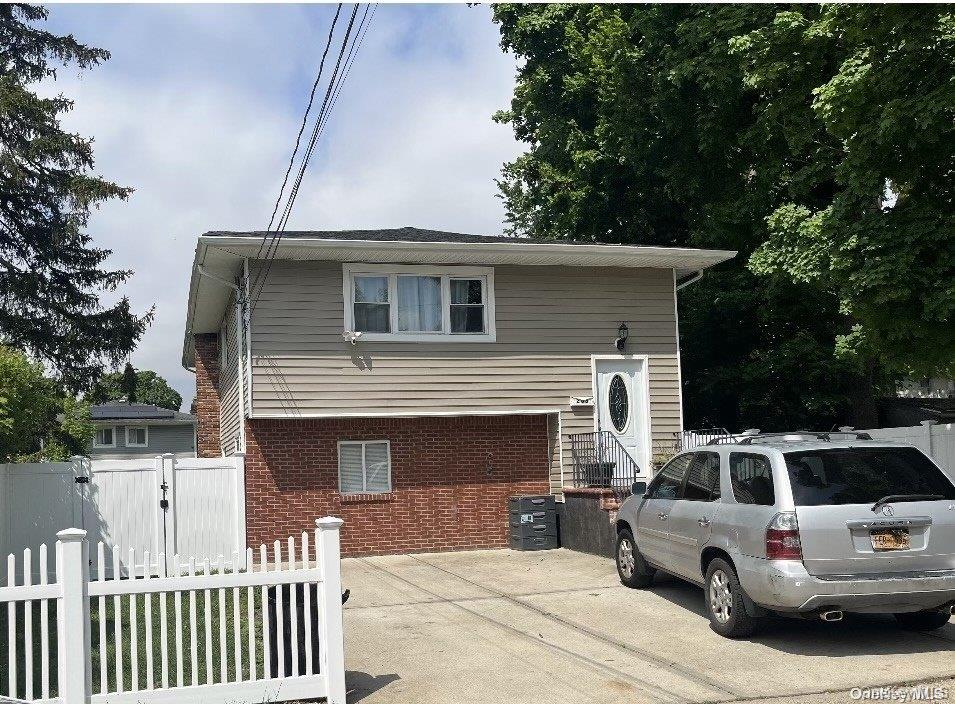 Beautiful Large meticulously kept 6 bedroom, 2 bathroom High Ranch in Westbury, Features Hardwood throughout, Spacious Living Room, Formal Dining Room, Family Room, Private 2 Car Driveway, huge Fenced in Yard. Updated siding and roof, natural gas.