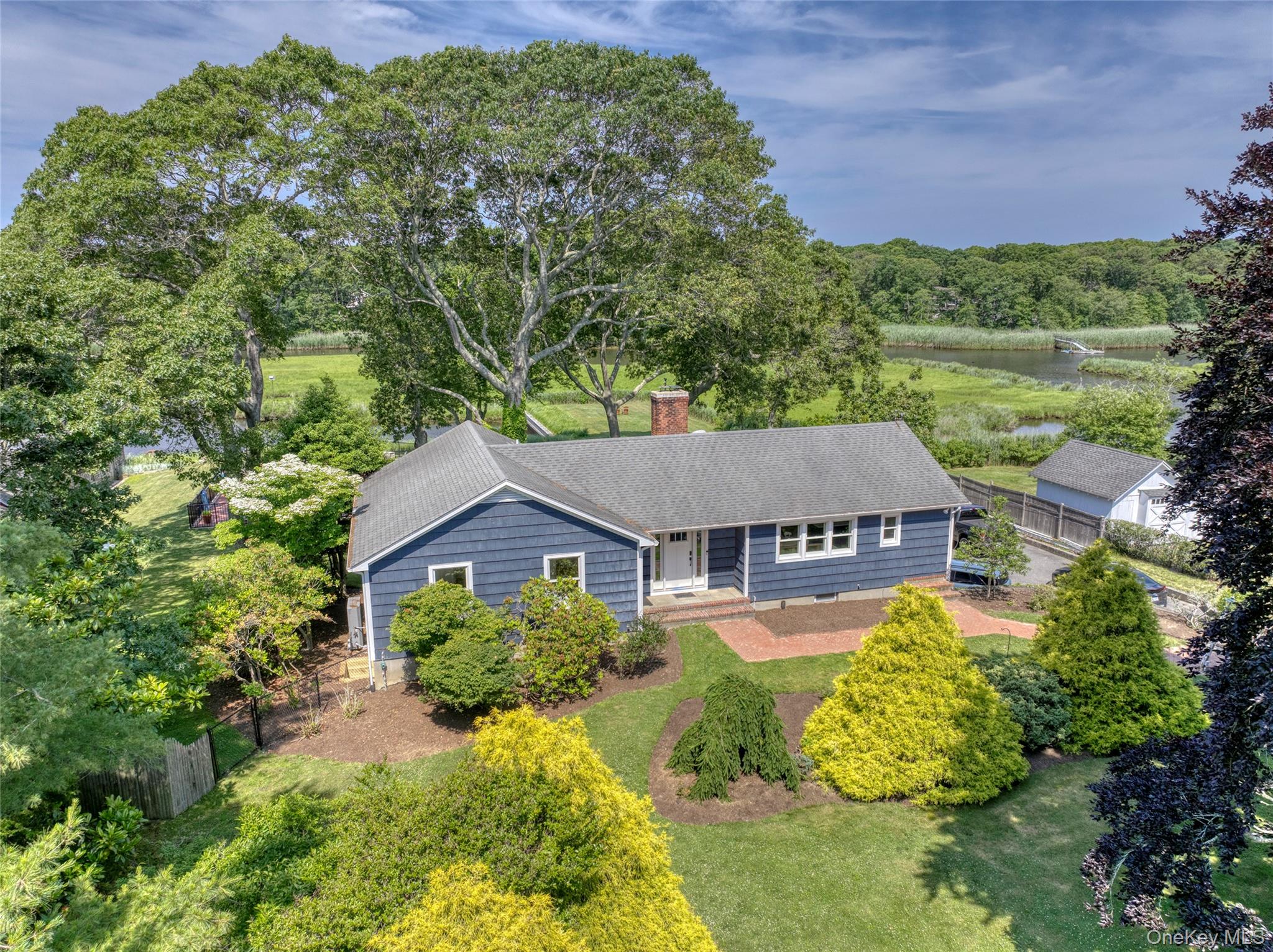 SUMMER 2026! Memorial Day to Labor Day $85, 000 // June $15, 000 // July $30, 000 // August - LD $35, 000 -- Experience the ultimate coastal getaway at this newly renovated Westhampton ranch! This stunning home, freshly updated in 2024, perfectly balances modern comfort with timeless coastal charm. Offering 3 spacious bedrooms and 2 full baths, including a luxurious ensuite master featuring a double vanity, a walk-in shower, and a relaxing soaking tub, it provides everything you need for a serene escape. The open-concept family room and eat-in kitchen are designed for both functionality and style, with beautiful backyard views that create seamless indoor / outdoor living. The gourmet kitchen boasts a large center island with seating for four, stainless steel appliances, and quartz countertops. Enjoy breathtaking views from the unique outdoor space, overlooking Beaverdam Creek. A covered boathouse, two boat slips with direct access to Moriches Bay, and over 100 feet of bulkhead with two floating docks offer endless opportunities for boating, paddle boarding, kayaking, fishing, and more. After a day on the water, unwind in the heated, gunite, in-ground pool, or host gatherings in the expansive yard designed for entertaining. Situated just a mile from Main Street, the home is within close proximity to all local attractions, shops, and restaurants Westhampton Beach has to offer. With its exceptional location and thoughtfully crafted upgrades, this home is the perfect retreat for those seeking a luxurious Hamptons summer. Rental Registration # RP240952