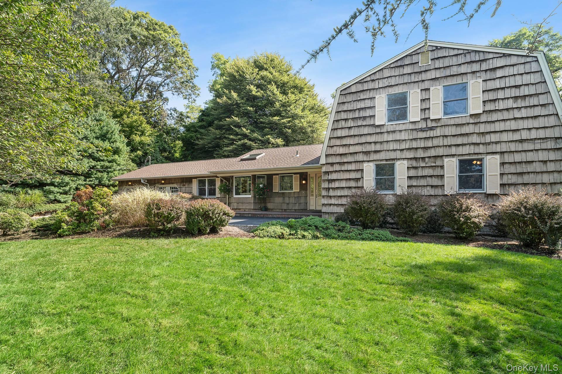 Welcome to 28 Plain View Drive in Wading River. Nestled in a well-established neighborhood, this charming residence offers generous living spaces and a warm sense of home in the scenic community of Wading River. This expansive property boasts 5 bedrooms and 3 full baths. The kitchen showcases custom quarry tile work, updated stainless steel appliances, and shaker-style cabinetry with built-in pantry storage. A formal dining room flows seamlessly into the spacious living room, creating an entertainer&rsquo;s dream layout-perfect for hosting gatherings. A wood-burning fireplace enhances the inviting atmosphere, complemented by hardwood flooring throughout. Complimenting the first level you have two guest bed rooms, full bath, and the primary bedroom with ensuite. Upstairs, you&rsquo;ll find two additional bedrooms, full bath, and a cozy den adding to the home&rsquo;s practicality and charm. Outdoors, the property is framed by mature landscaping, including a stunning decades-old Japanese Beech tree. A wood deck surrounds the in-ground pool, accented by vibrant flowers and professionally maintained greenery-an ideal setting for relaxation or entertaining. This home is filled with character and set in a truly picturesque town. Only a short 15 minute walk to Wading River Beach. Don&rsquo;t miss the opportunity-schedule your private showing today!