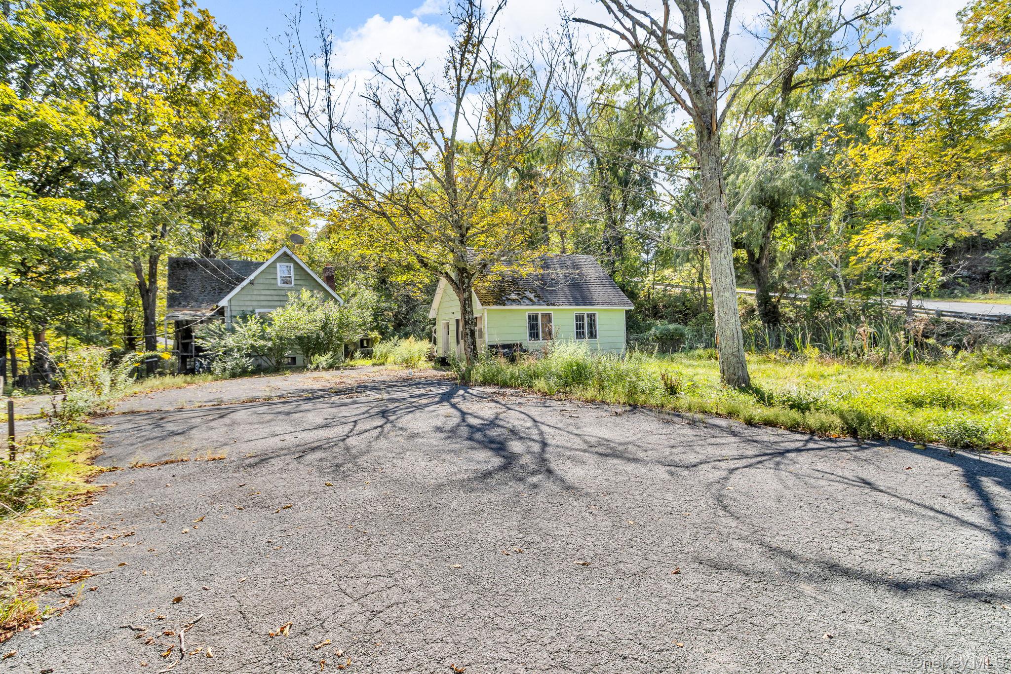 Unique two-home (multiple dwelling) investor opportunity in Cairo. This package includes 31 Foster Road, a spacious four-bedroom, 1.5 bath home on over four acres, together with 21 Foster Road, a separate two-bedroom cottage on an adjacent lot. Both properties offer privacy, wooded surroundings, and excellent potential for restoration. Ideal for multi-generational living, a guest house setup, or as an investment with rental income possibilities. Bring your visionâ€”whether you update, renovate, or rebuild, these homes provide a rare chance to own multiple parcels with flexible uses in one purchase. Conveniently located near town, shopping, and Catskill attractions, with easy access to the NYS Thruway. Being sold in as-is condition.