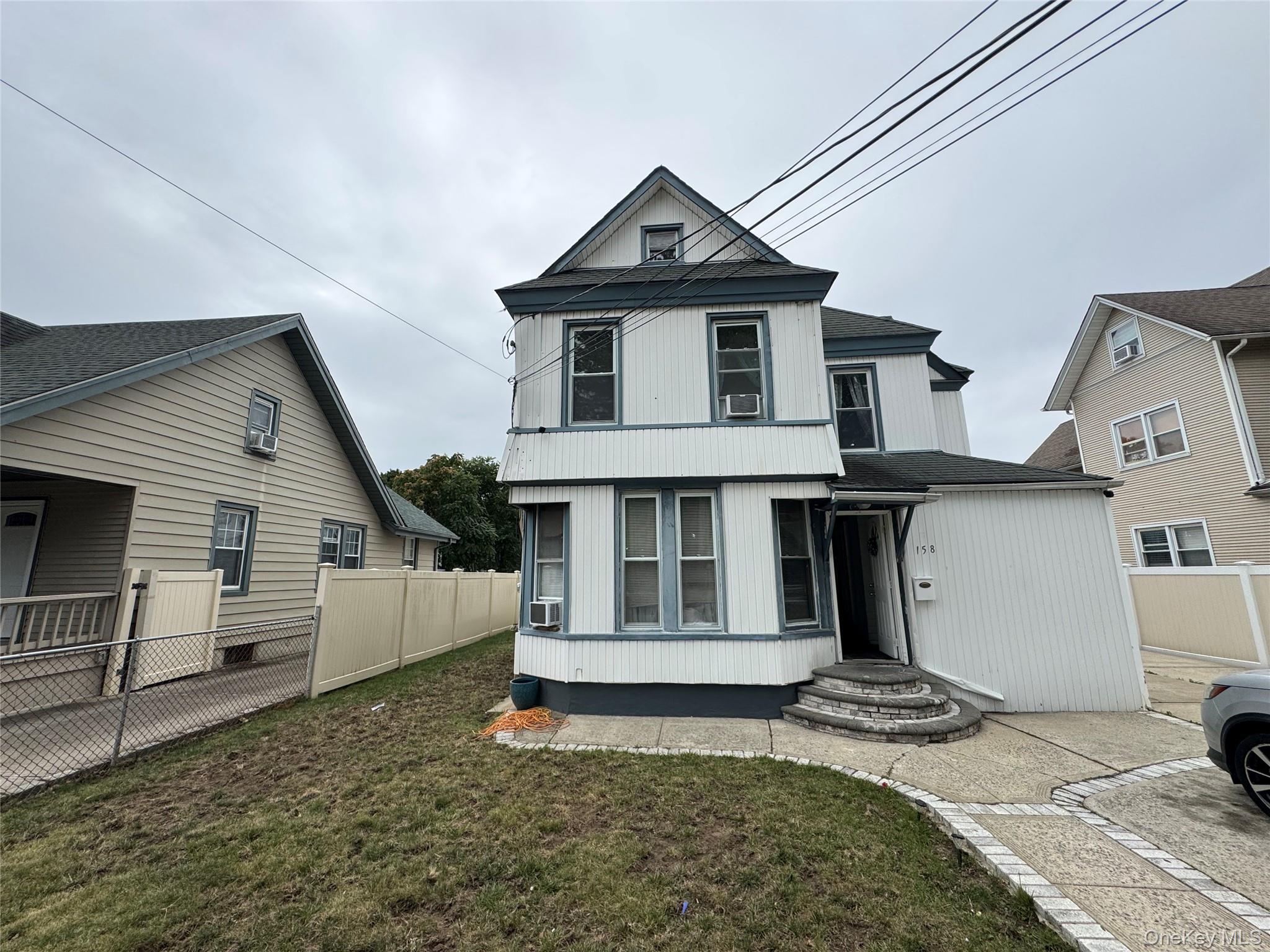 Multi-family with 3 separate units. Upstairs, you have a 2 bedroom unit with a finished attic. The first floor consists of 2 (one) bedroom units. All three units have full eat in kitchens. House needs a decent amount of work, but is in very livable condition. The sellers live upstairs and both units are rented downstairs. Driveway can fit 8+ vehicles and it has a large backyard. House also has three separate gas meters. Additional village taxes are around $3500 agent must verify.
