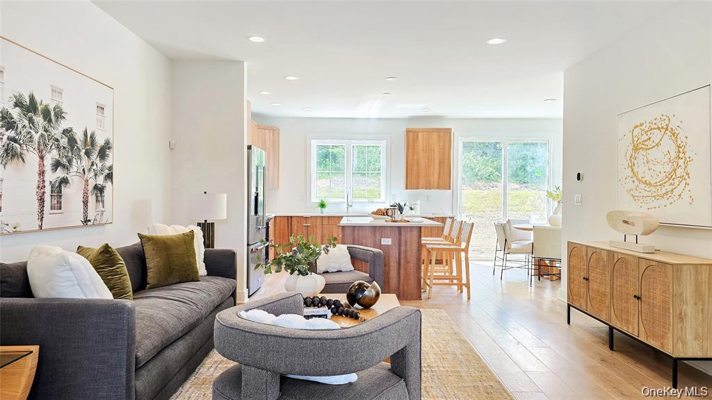 Fall 2025 Occupancy. The Colgate welcomes you with a soaring two-story foyer and graceful staircase that leads to the bright and open living level. Here, a spacious great room, formal dining room, and casual dining area with rear yard access create the perfect setting for gatherings. The well-designed kitchen features a generous center island with breakfast bar, wraparound counter and cabinet space, and a roomy pantry. The serene primary suite offers a large walk-in closet and a spa-like bath with dual vanities and a luxe shower with seat. Secondary bedrooms, each with vaulted ceilings and ample closets, share a full hall bath. Additional highlights include a conveniently located bedroom-level laundry, a powder room on the main living level, and an everyday entry from the lower level.
