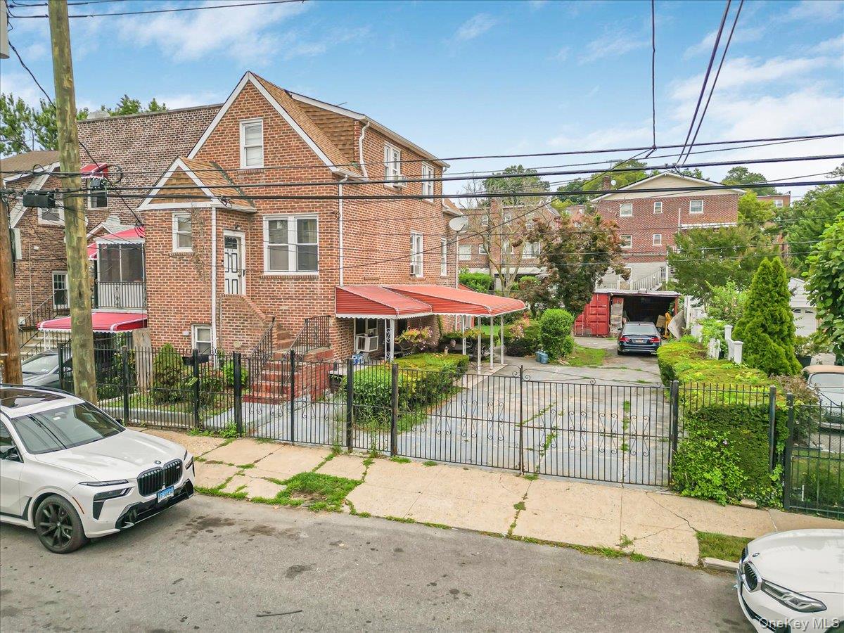 Solid 2-Family home here. Top floor is a 1-bedroom apartment and a 2 bedroom duplex apartment on walk-in level. Included in sale is the adjacent 25x95 lot. R4 zoning.