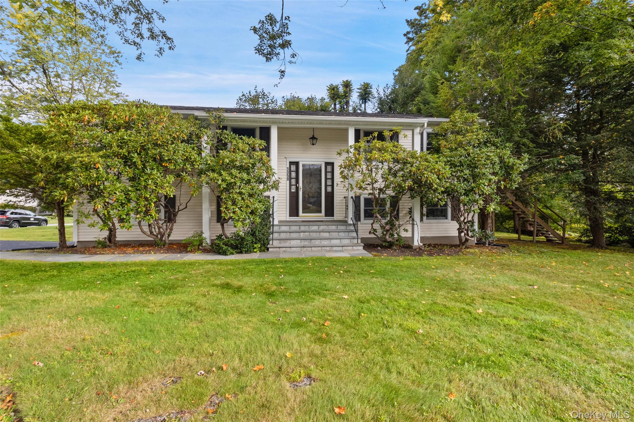 Welcome to 1350 Ellen Lane in Yorktown Heights â€“ lovingly cared for by the same owners for 50+ years. This 4-bedroom, 2.5-bath home has been well maintained over the years and offers solid bones, ready for your personal updates and vision. While mature shrubs and trees currently cover part of the front exterior, thoughtful pruning will reveal the homeâ€™s full charm and curb appeal.The upper level features 3 bedrooms and 2 full baths, including a primary suite with its own ensuite. The kitchen opens to the dining and living areas, where sliding glass doors lead to a deck overlooking the yard â€“ a wonderful spot to relax and enjoy the seasons.The lower level offers a 4th bedroom, half bath, and a comfortable family room with access to the rear patio and backyard, providing flexible space for everyday living or entertaining.A nice bonus: the driveway is located on Claire Street, a cul-de-sac, adding extra convenience and privacy to the property.Conveniently located near the Taconic State Parkway, shopping, and within the Yorktown School District, this home presents a fantastic opportunity to create a space that reflects your style while building on years of thoughtful ownership.