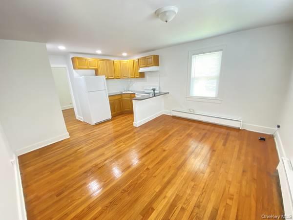 Nice redone apartment with open floor plan with breakfast bar. Bath is with shower hardwood floors, front porch on the first floor. Close to shops and bus on Main Street.