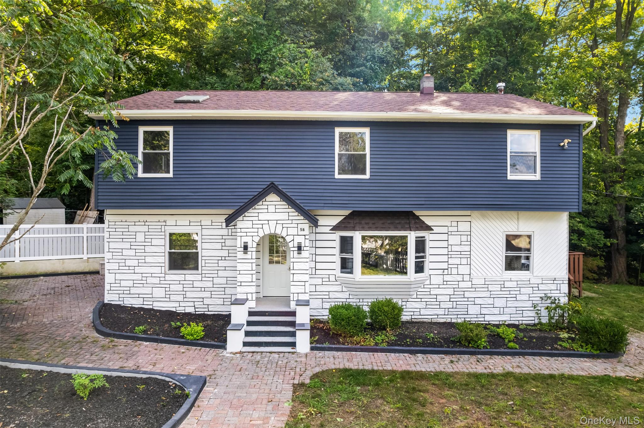 Welcome to your dream home in the heart of Greenwood Lake! Step inside this renovated colonial to find an open-concept living room area flooded with natural light and warmth, complemented by new engineer wood flooring throughout, recessed lighting, fresh neutral paint and custom molding invite you along the entire first floor. Brand new kitchen featuring sleek stainless steel appliances, soft closing cabinetry, large window/skylight to provide tons of natural light, flowing into a generously sized open concept dining room- perfect for large family gatherings, along with a full bathroom which has been entirely renovated. There is also an entrance to your mud room on the side of the property, which includes your washer/dryer hookup. As you move up to the second floor, you will find four spacious and generously sized bedrooms and two full bathrooms all fully renovated, as well as a bonus room- perfect for playroom, guest room, office. A true pleasure to tour! Just a few minutes away from Greenwood Lake, Marinas, Restaurants and so much more activities to explore. 20 minutes to Woodbury Common Premium Outlets and about an hour from the city!