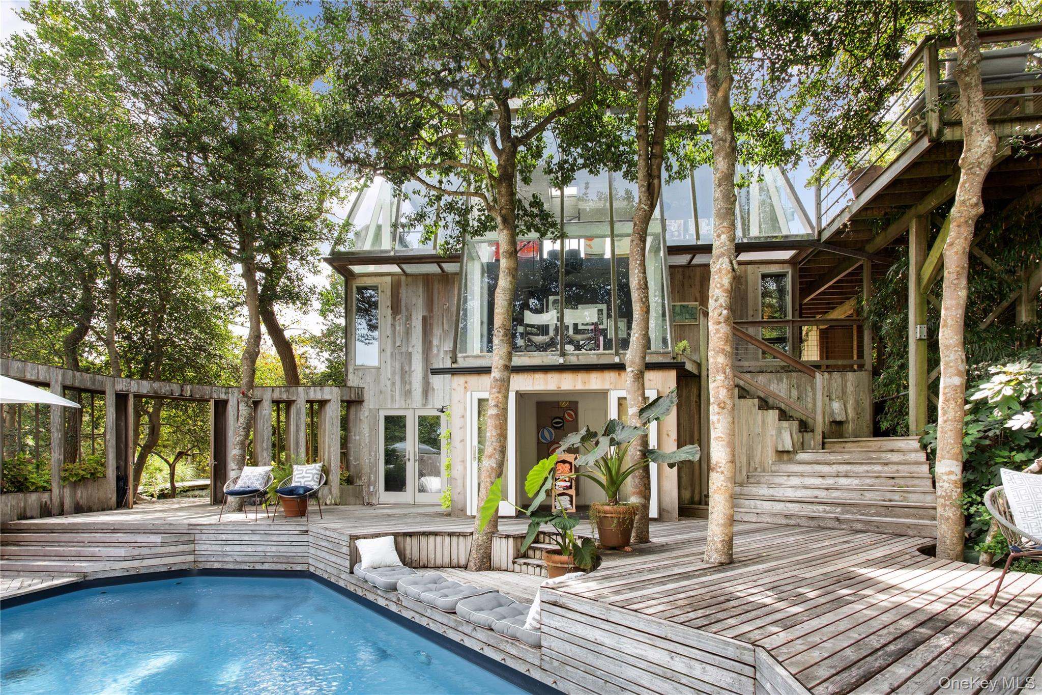 One-of-a-kind Horace Gifford â€œtree houseâ€. This 3 bedroom, 3 bathroom,  dramatically set at the eastern edge of the Pines,  is truly a one-of-a-kind residence.  A spiral staircase leads you above the trees into the breathtaking, glass enclosed Great Room. Multi level decking allows for both large scale entertaining or more intimate gatherings. While respecting Giffordâ€™s original plan, the current owners have put their own stamp on the property including a heated pool, hot tub, poolside kitchenette, remodeled kitchen and appliances, complete bathroom renovations and other luxe amenities . The heart stopping roof terrace soars above the tree line revealing the preserved dunes and Atlantic Ocean stretching eastward .